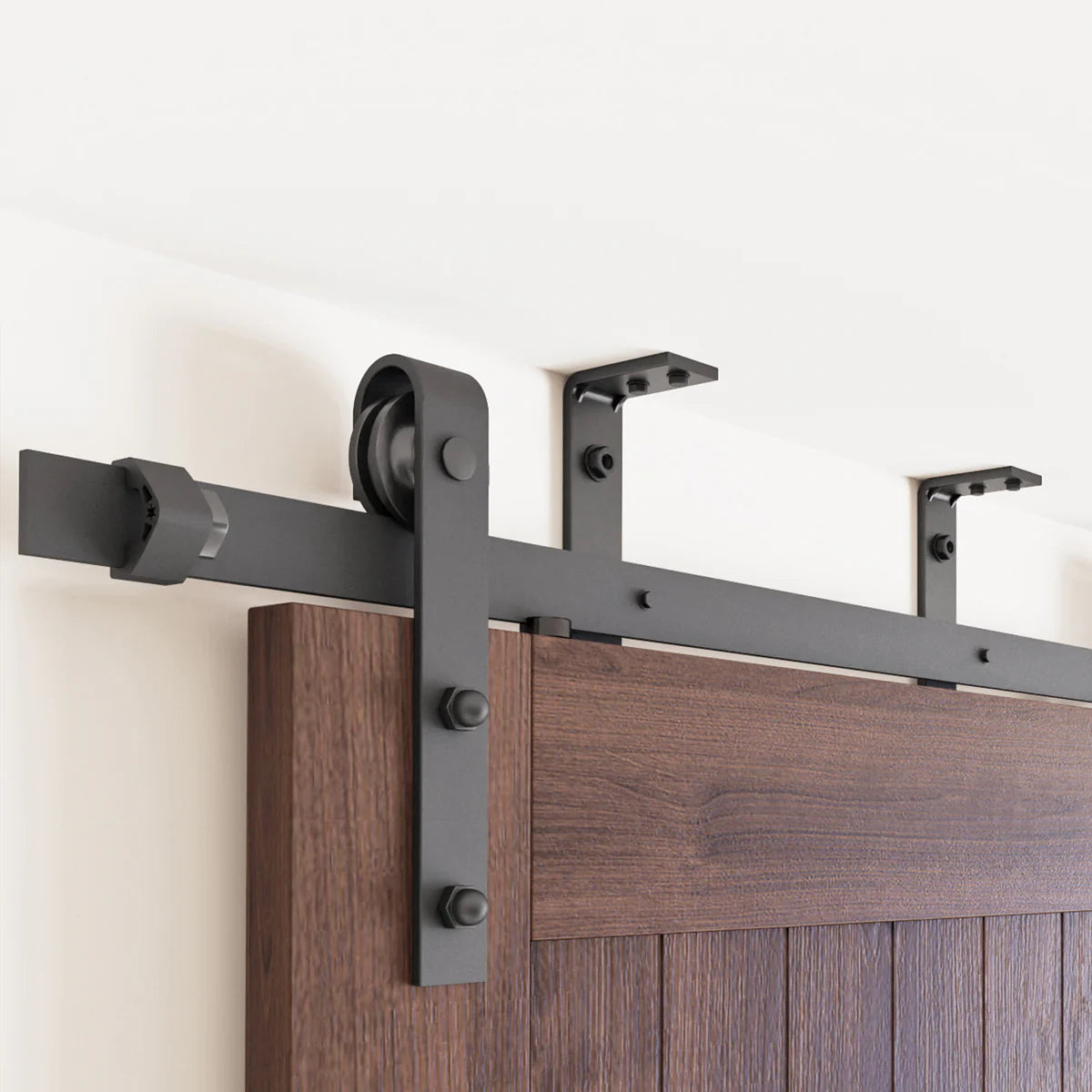 Black classic roller barn door hardware kit installed on one door.