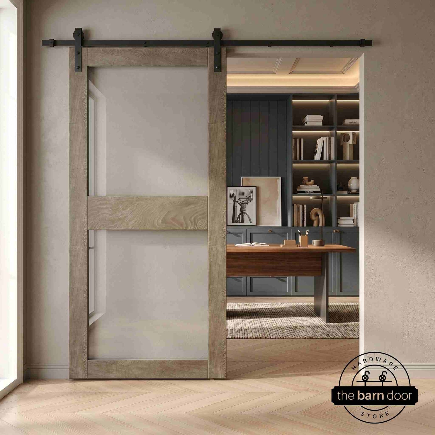Wooden sliding glass barn door in a modern interior setting with a desk and shelves.