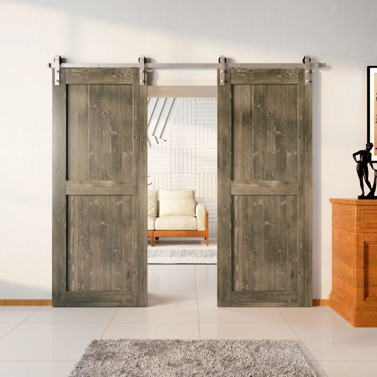 Two wood double barn doors with a two-panel vertical plank design in a Classic Gray stain, installed with brushed nickel sliding hardware, partially revealing a living room area.