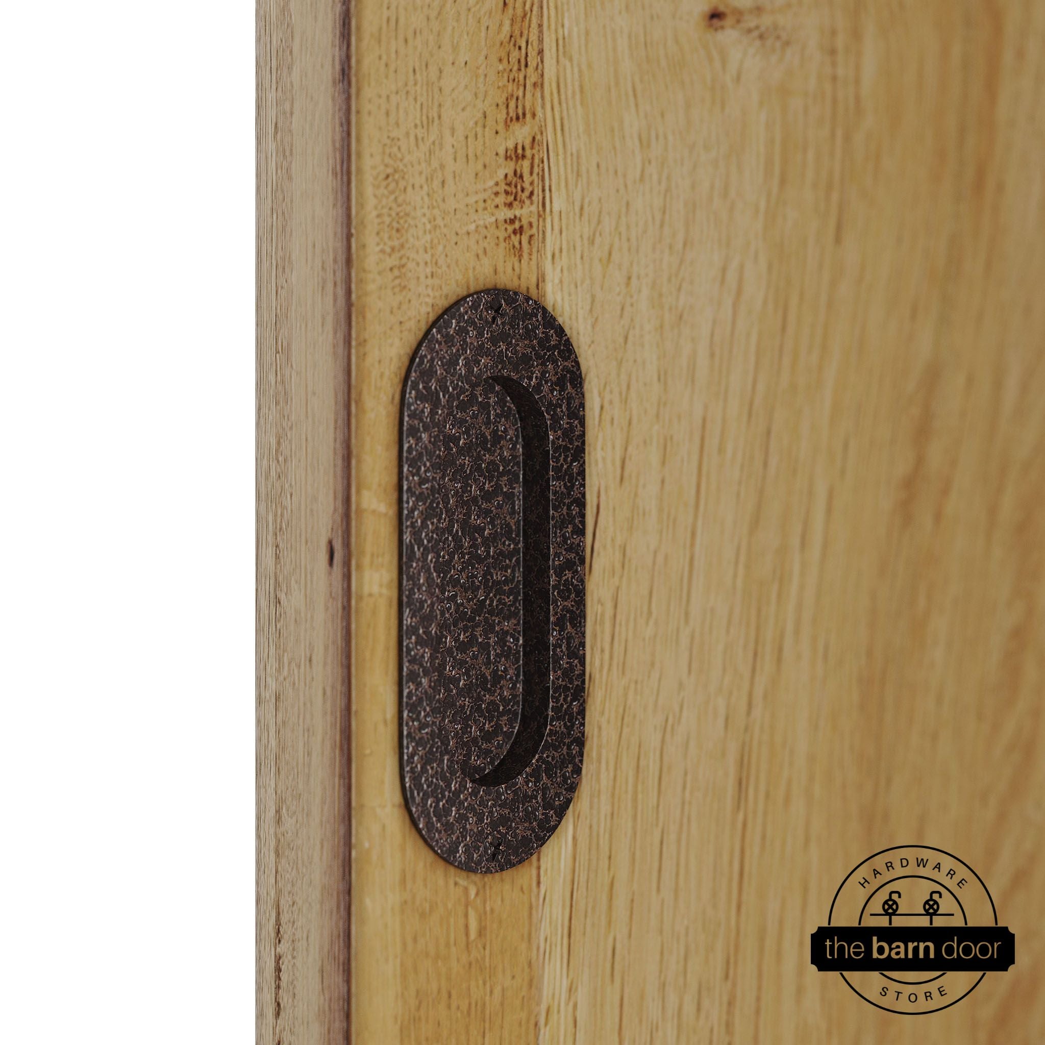 Wooden door with a copper vein flush pull handle.