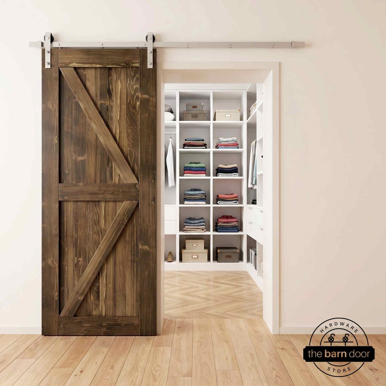 Brushed nickel barn door hardware kit on a dark walnut K-brace barn door, modern farmhouse style.