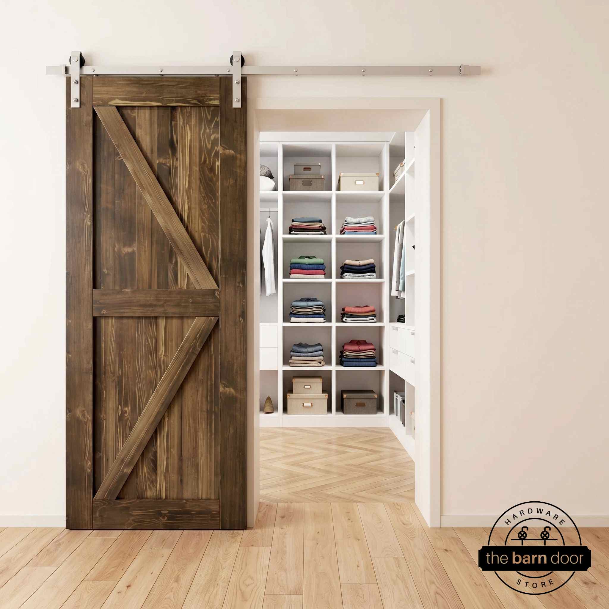 Brushed nickel barn door hardware kit on a dark walnut K-brace barn door, modern farmhouse style.