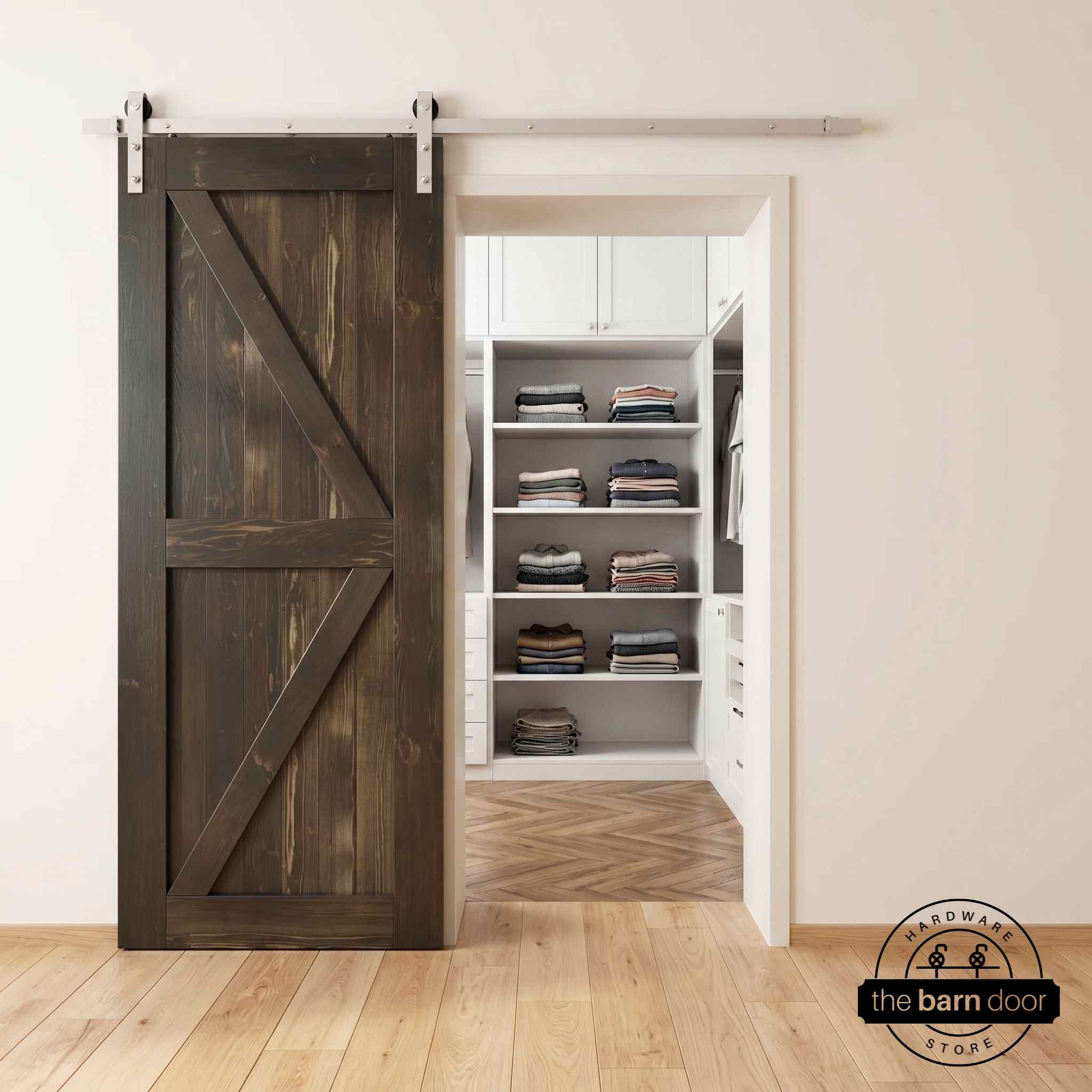 Brushed nickel barn door hardware kit on a ebony K-brace barn door, modern farmhouse style.