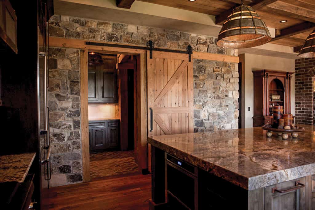 Wagon Wheel Barn Door Hardware in Kitchen by TBDHS