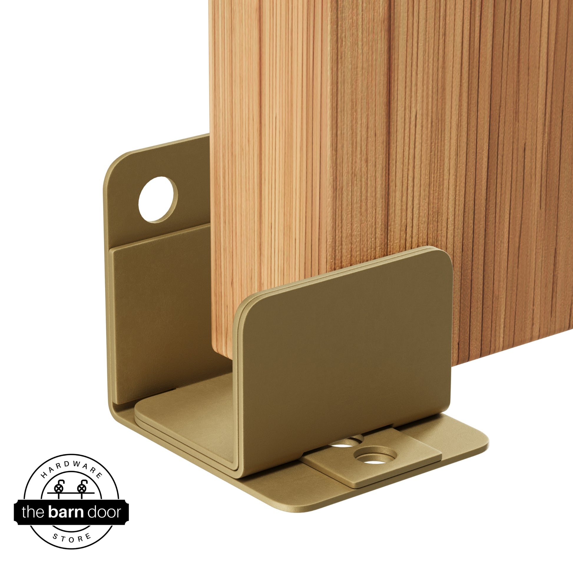 A gold U-shaped floor guide with a side plate, holding a light wood barn door in place.