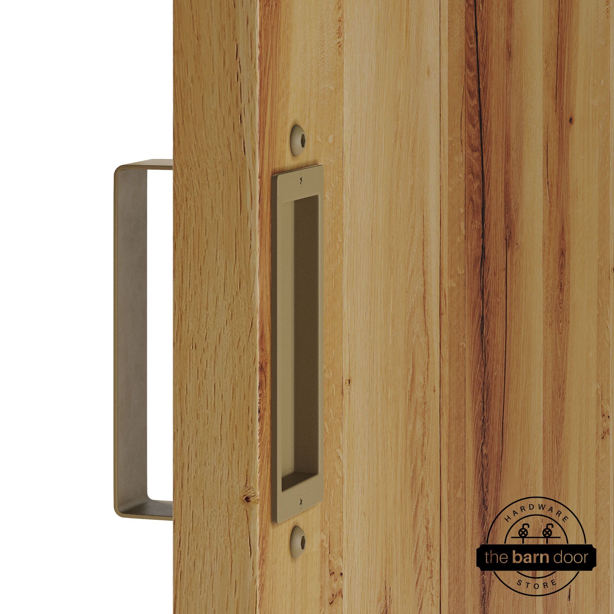 Gold barn door pull handle set installed on a natural wood sliding door, featuring a rectangular U-shaped pull handle on the front face and a flush recessed pull plate on the reverse side, shown in a gold finish.