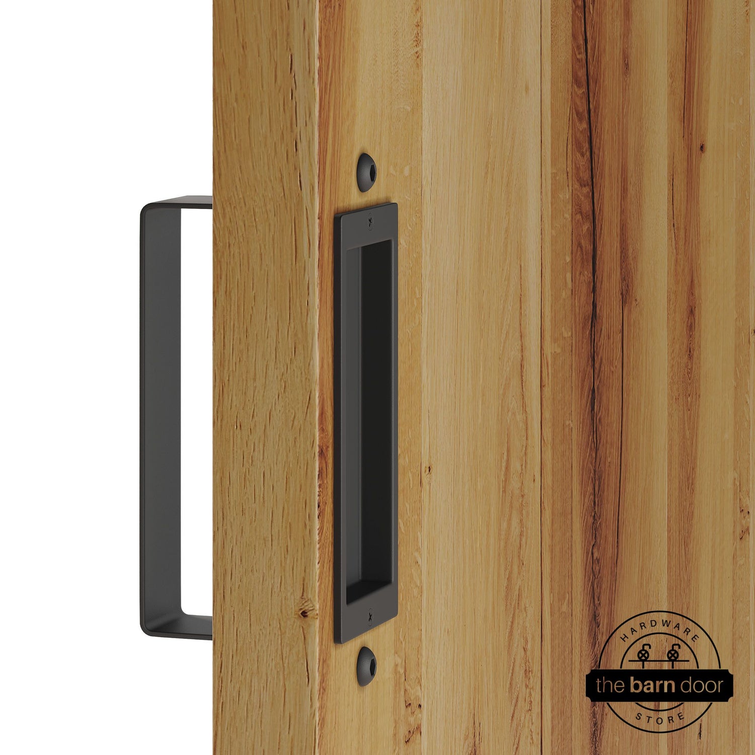Matte black barn door pull handle set installed on a natural wood sliding door, featuring a rectangular U-shaped pull handle on the front face and a flush recessed pull plate on the reverse side, shown in a matte black finish.