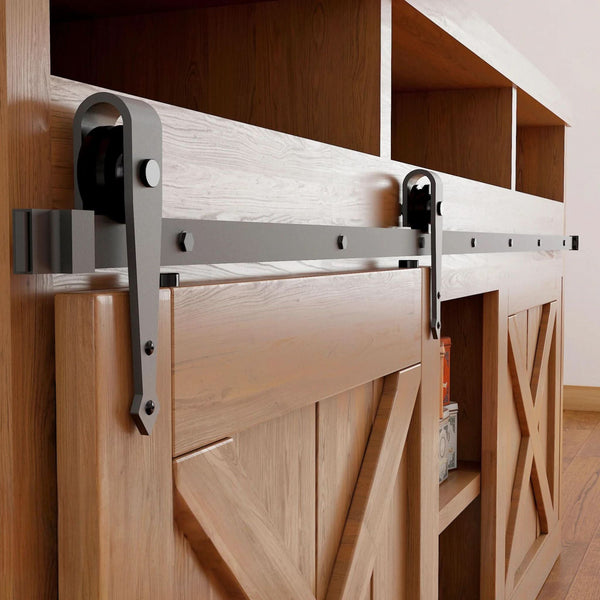 Arrow cabinet barn door hardware kit in matte black with a single track, shown installed on a small wooden cabinet door.