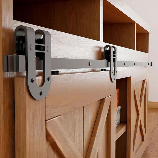 Horseshoe cabinet barn door hardware kit in matte black with a single track, shown installed on a small wooden cabinet door.