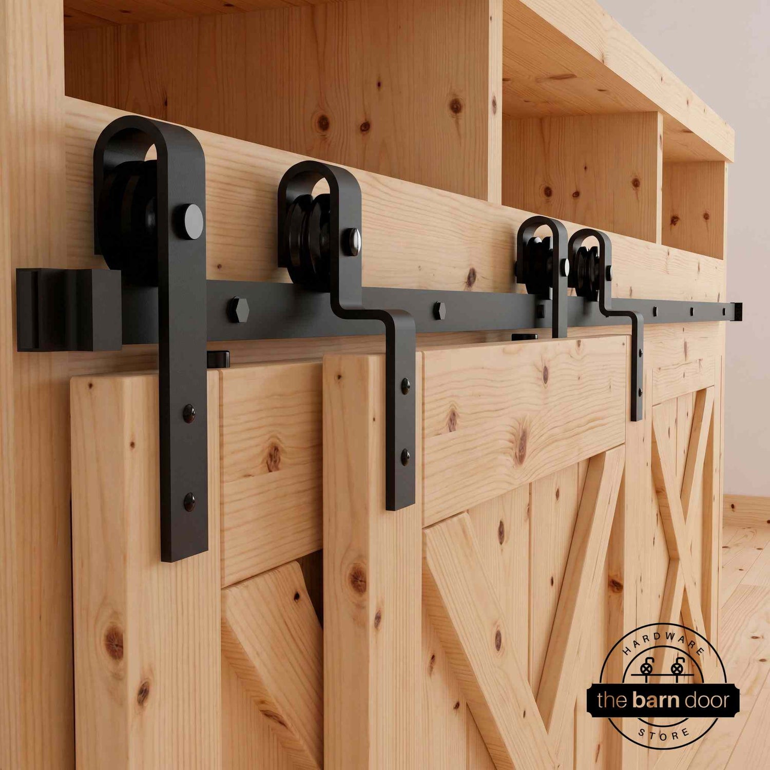 Matte black J-Strap mini bypass cabinet barn door hardware kit on a single track, shown on a small two-door wooden cabinet.