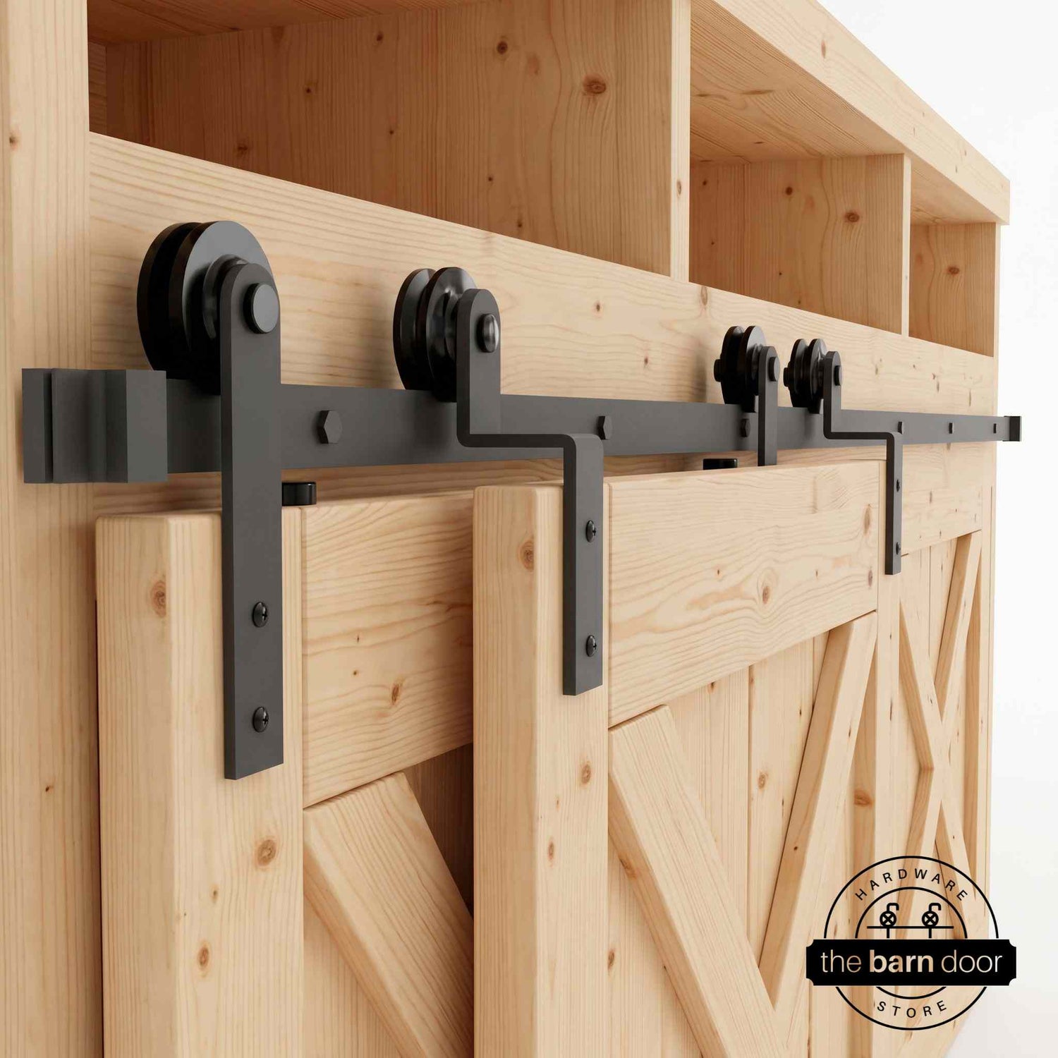 Matte black Straight Strap mini bypass cabinet barn door hardware kit on a single track, shown on a small two-door wooden cabinet.