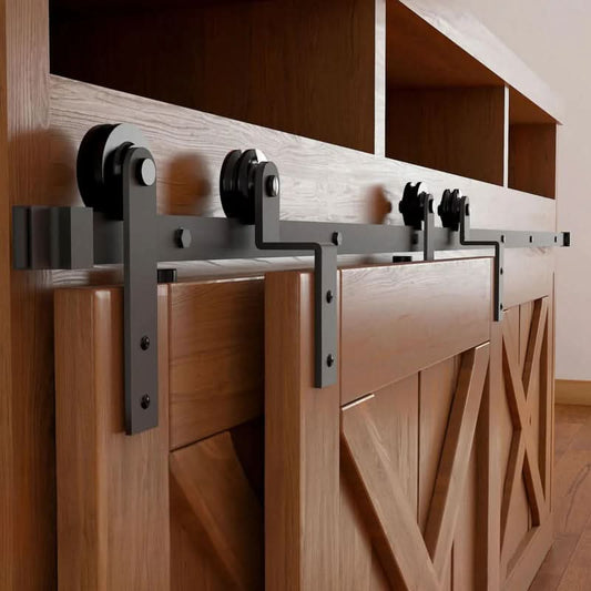 Matte black Straight Strap mini bypass cabinet barn door hardware kit on a single track, shown on a small two-door wooden cabinet.