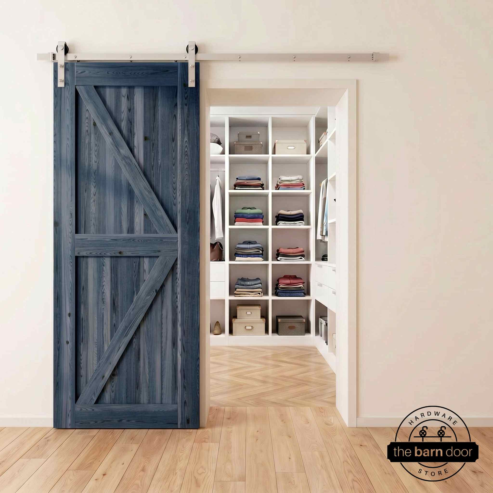 Brushed nickel barn door hardware kit on a navy K-brace barn door, modern farmhouse style.
