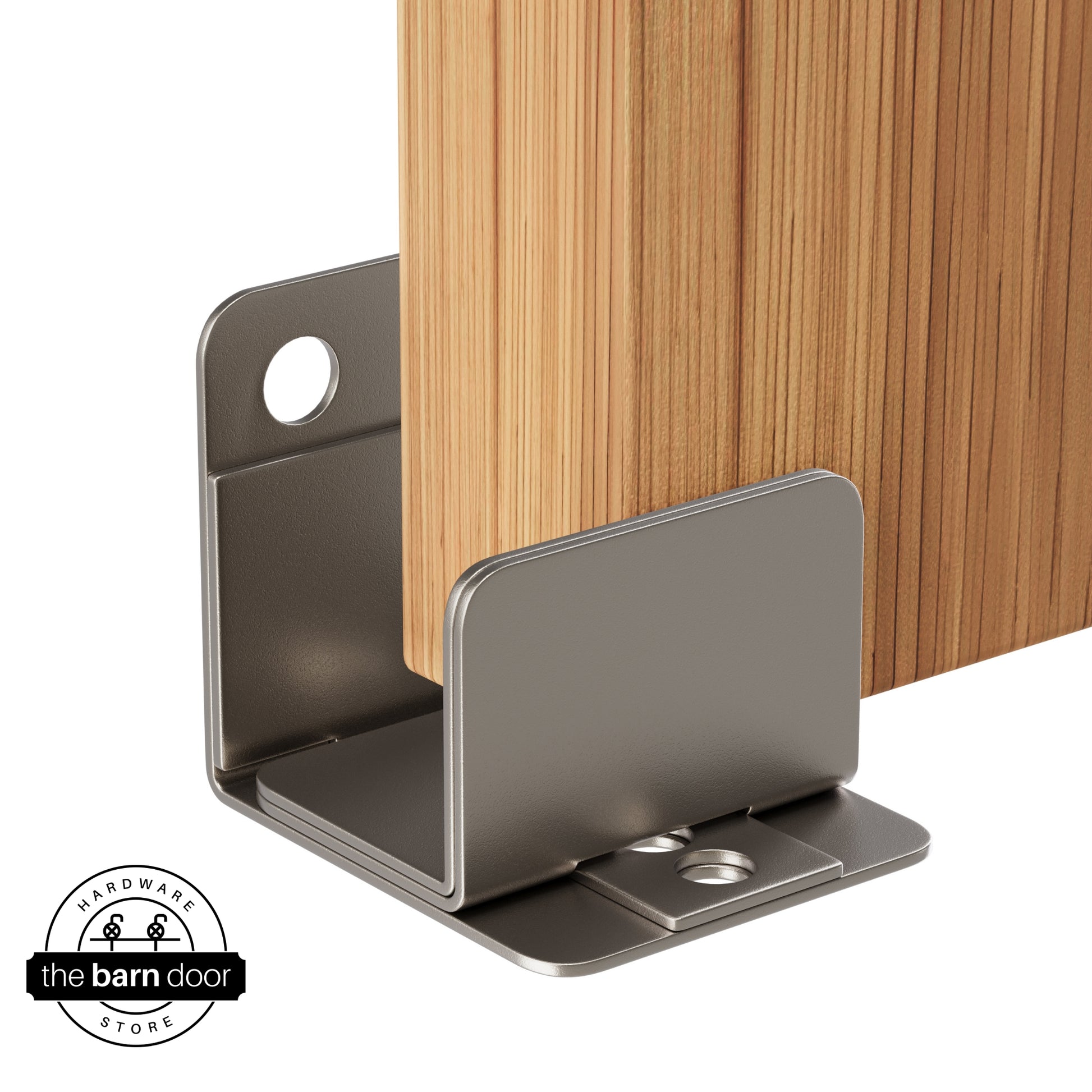 A PC Chrome U-shaped floor guide with a side plate, holding a light wood barn door in place.