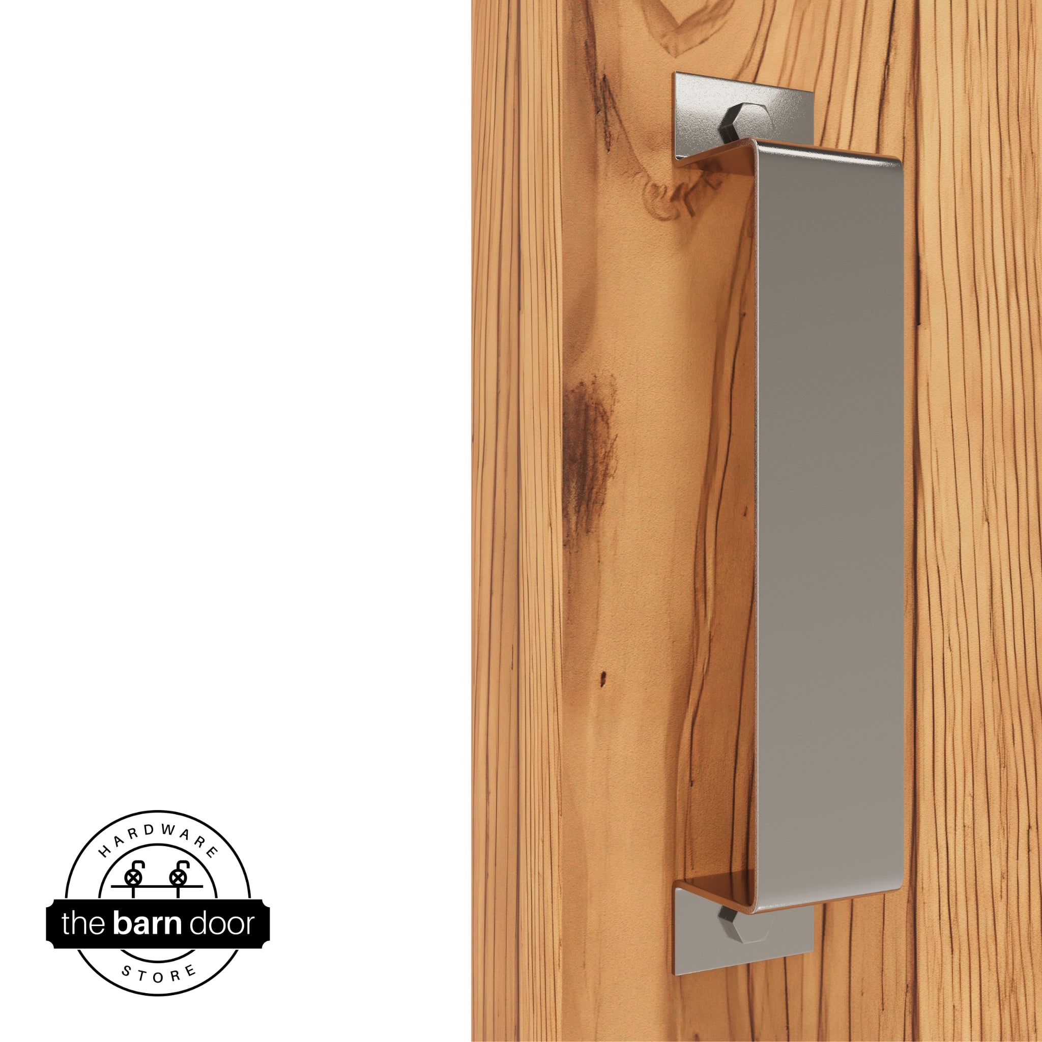 A PC Chrome, arch-shaped barn door handle is mounted on a light-colored wooden door with a vertical grain pattern.