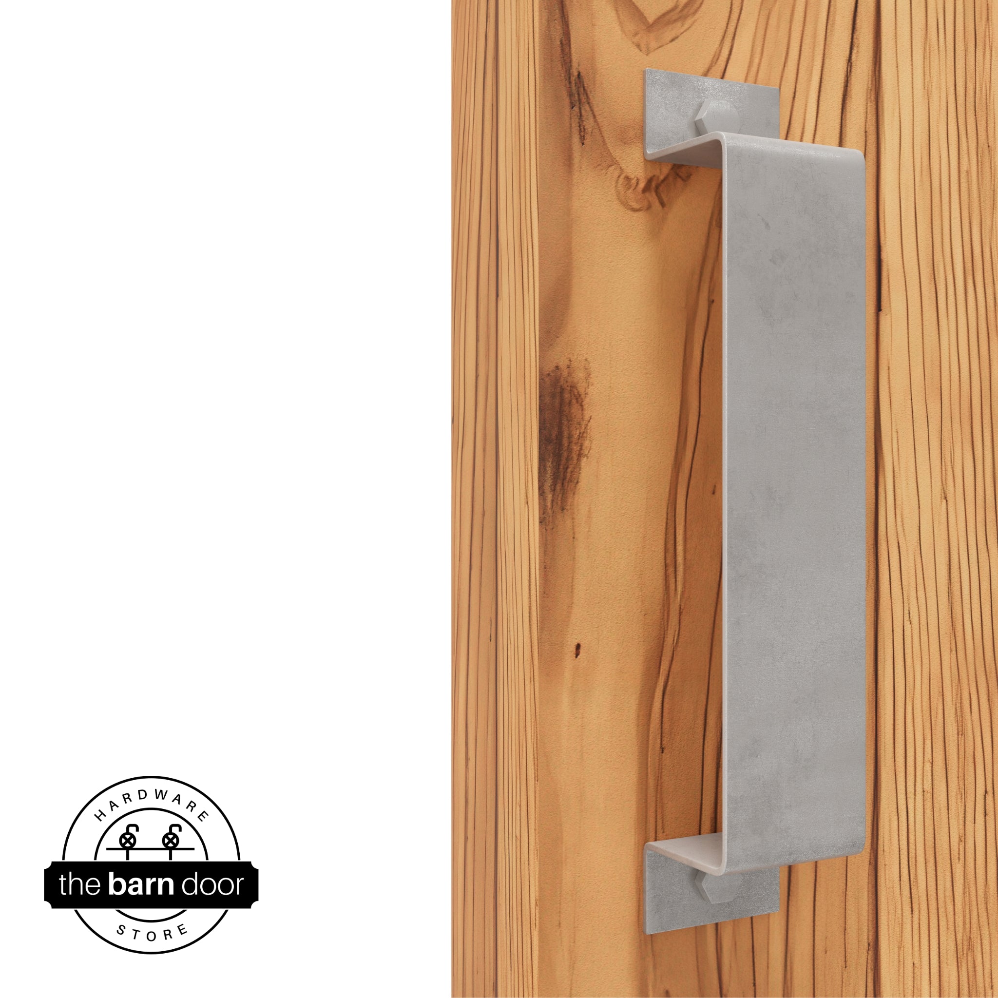 A raw steel, arch-shaped barn door handle is mounted on a light-colored wooden door with a vertical grain pattern.