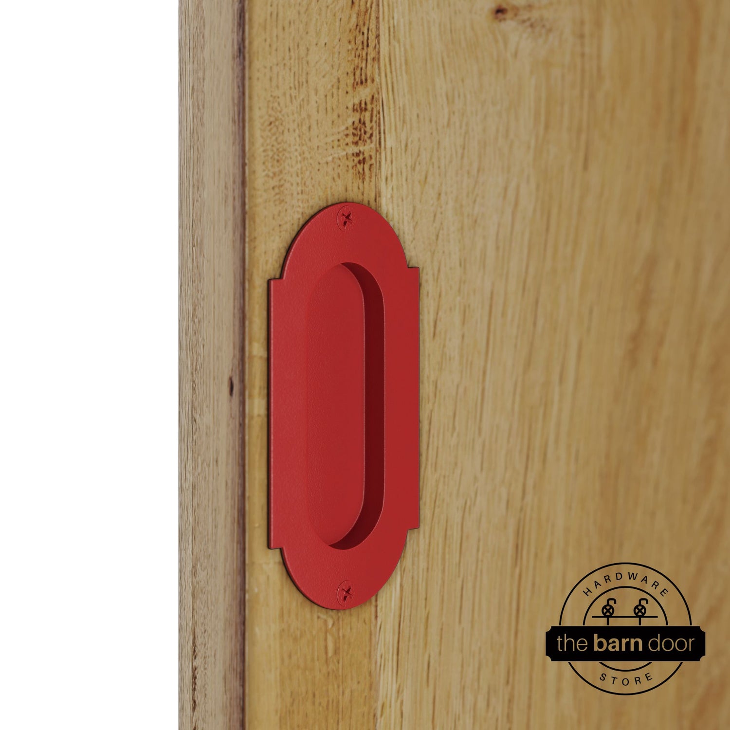 Red flush pull handle with full radius wings mounted on a light oak barn door, brushed silver finish with oval recessed grip and four mounting screws