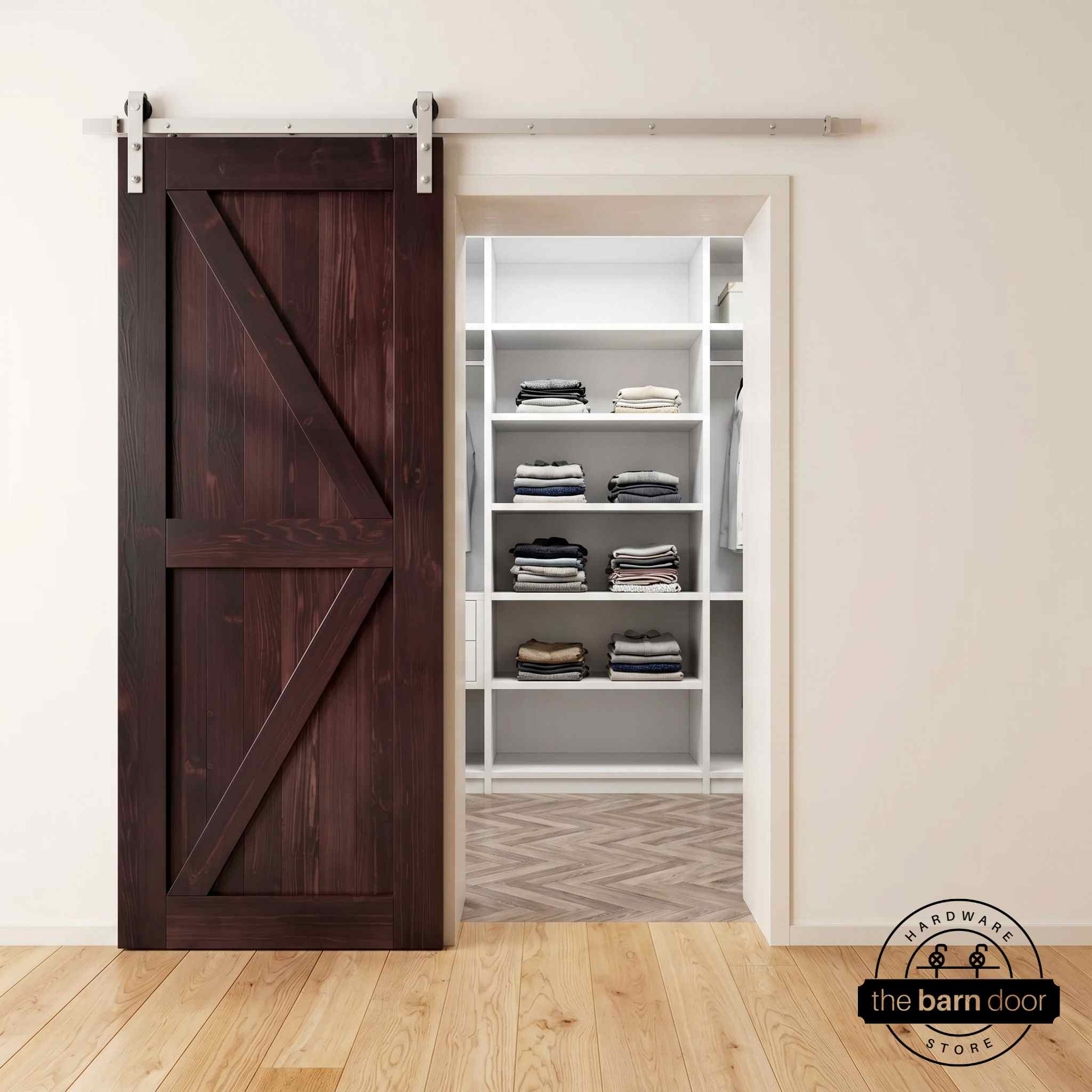 Brushed nickel barn door hardware kit on a red mahogany K-brace barn door, modern farmhouse style.