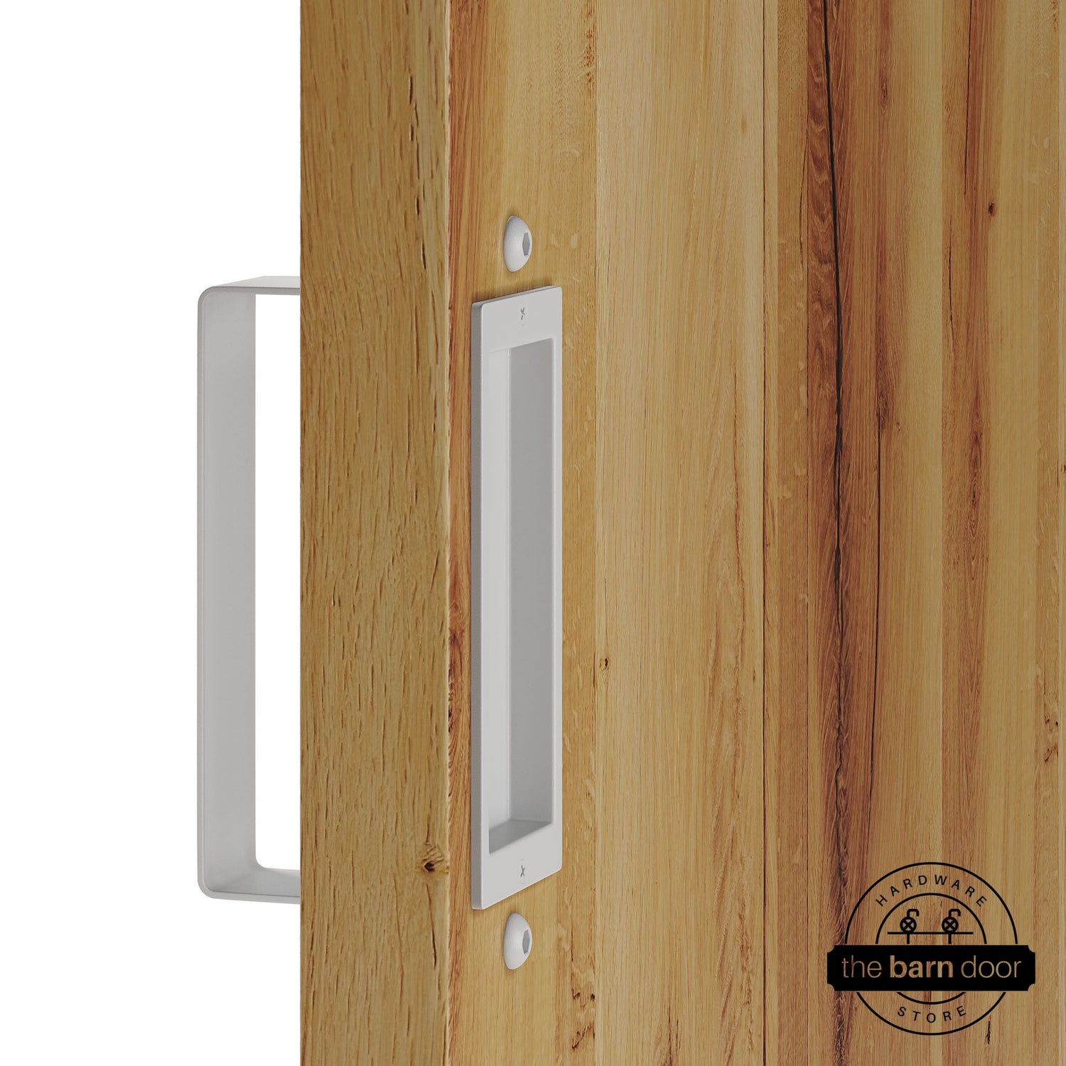 White barn door pull handle set installed on a natural wood sliding door, featuring a rectangular U-shaped pull handle on the front face and a flush recessed pull plate on the reverse side, shown in a white finish.