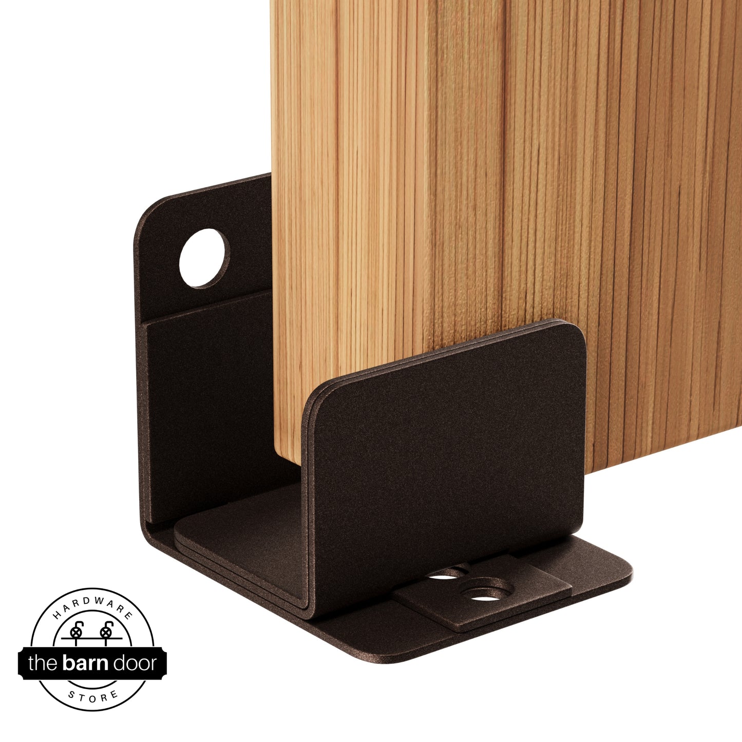 A rustic brown U-shaped floor guide with a side plate, holding a light wood barn door in place.