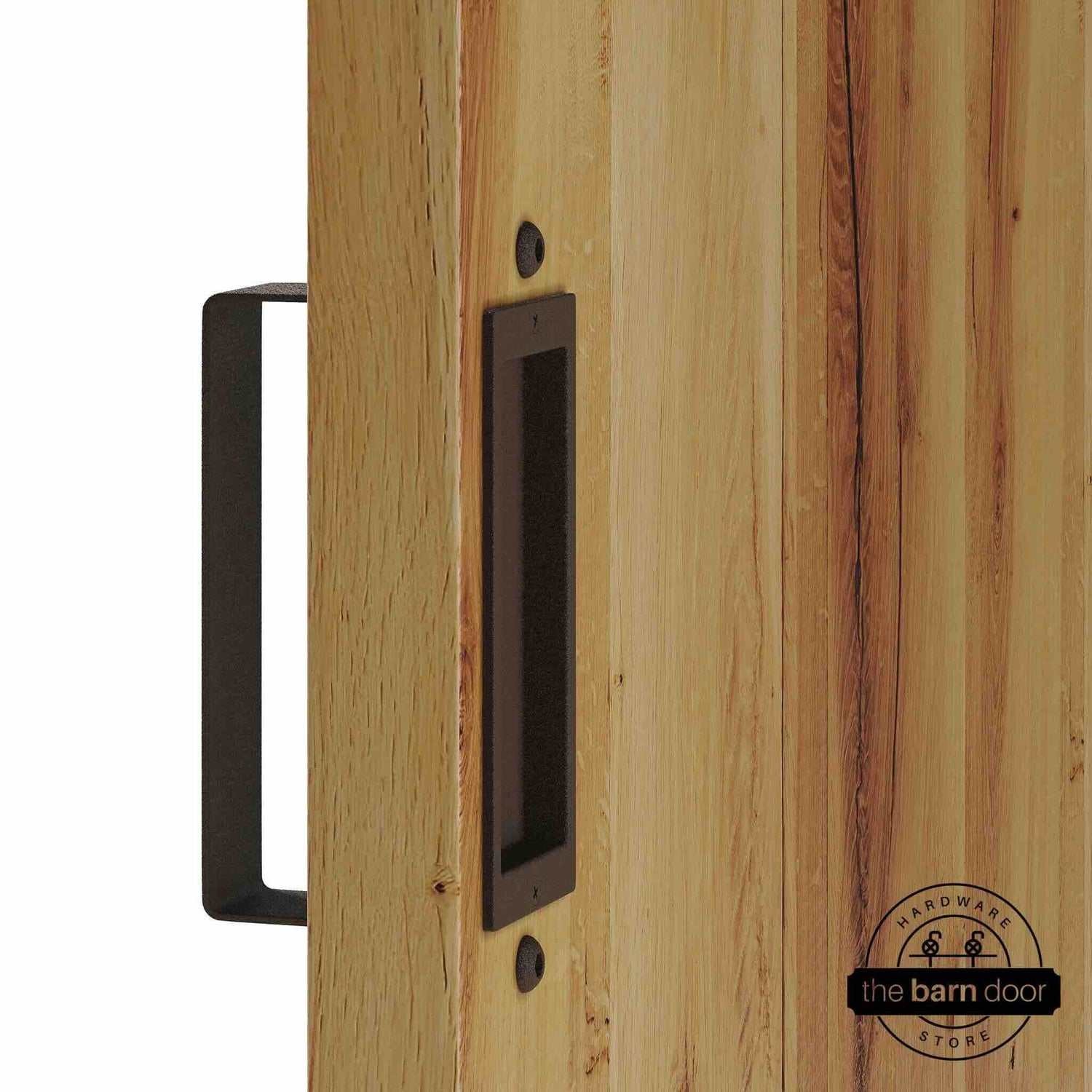 Rustic brown barn door pull handle set installed on a natural wood sliding door, featuring a rectangular U-shaped pull handle on the front face and a flush recessed pull plate on the reverse side, shown in a rustic brown finish.