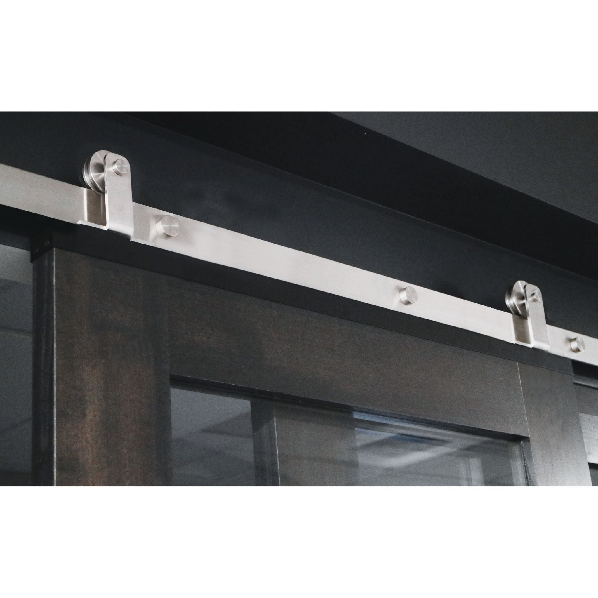 Stainless Steel Barn Door Hardware on Dark Stained Barn Door