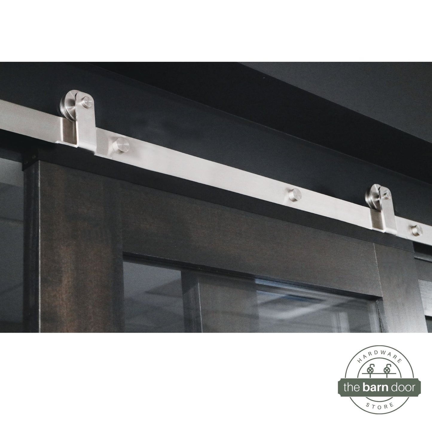 Stainless Steel Barn Door Hardware on Dark Stained Barn Door