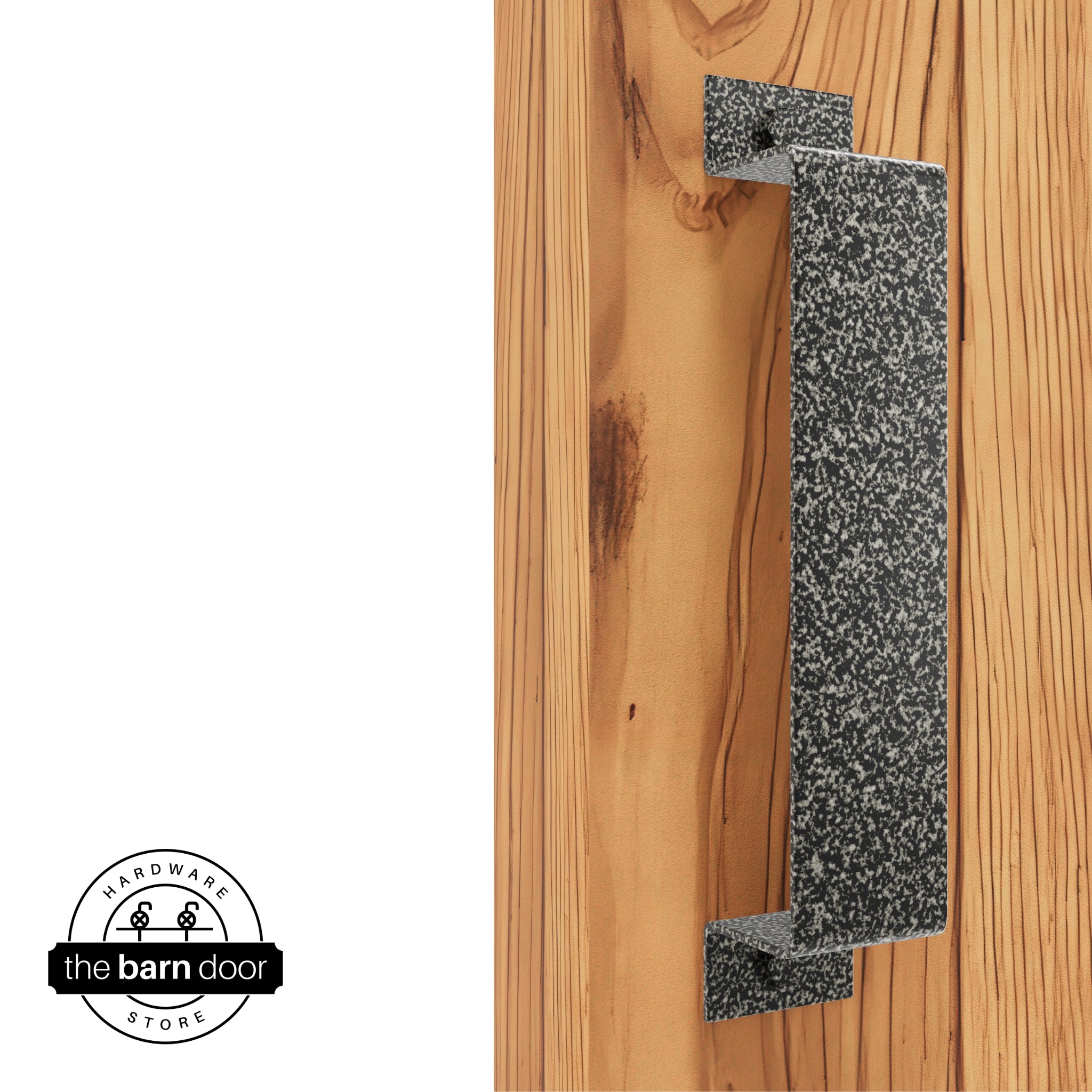 A silver vein, arch-shaped barn door handle is mounted on a light-colored wooden door with a vertical grain pattern.