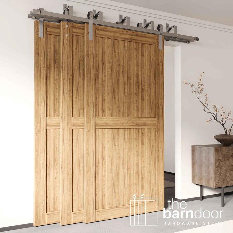 J-Strap Triple Track Bypass Barn Door Hardware Kit in a brushed nickel finish, showing three barn doors on a multi-track system.