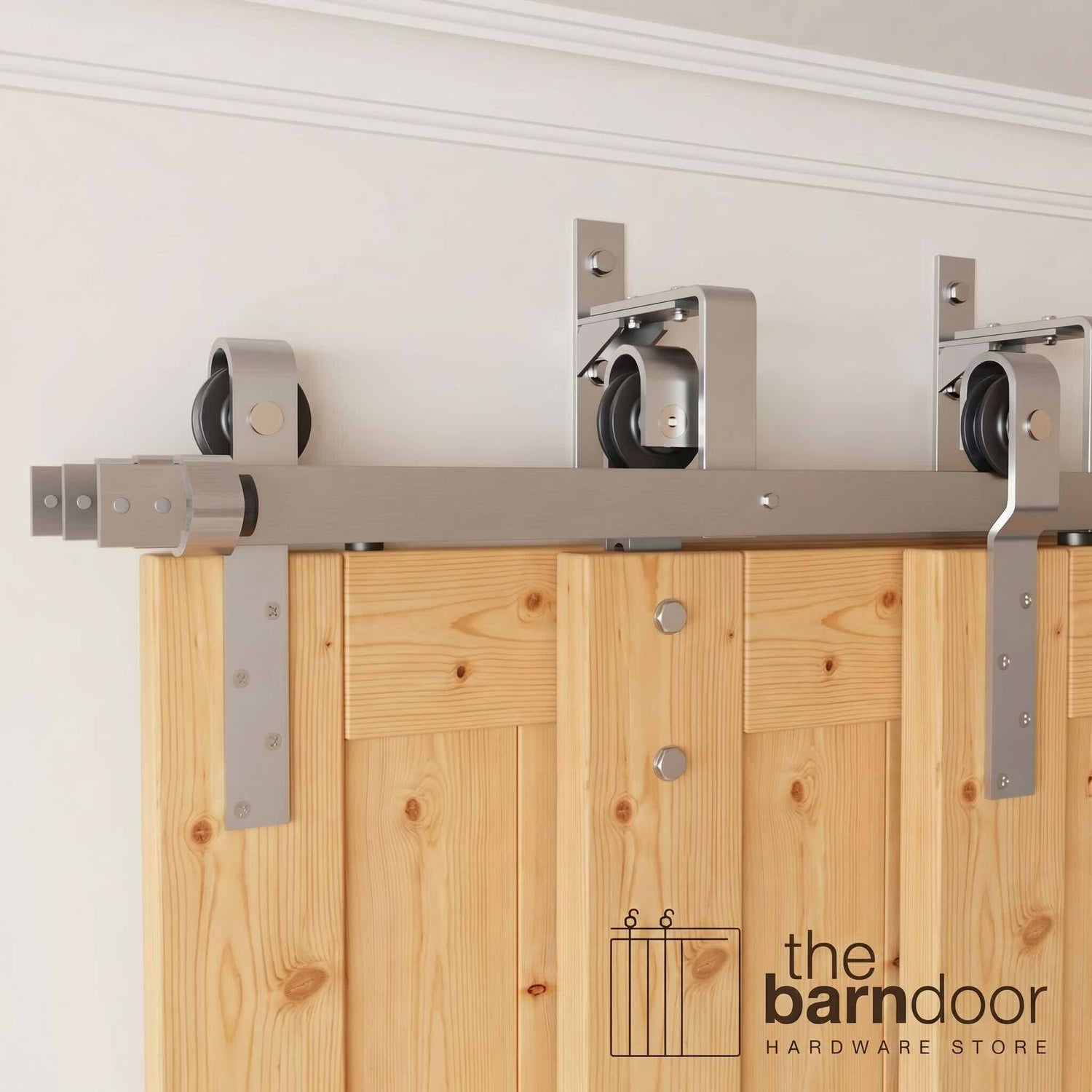 J-Strap Triple Track Bypass Barn Door Hardware Kit in a brushed nickel finish, showing three barn doors on a multi-track system.