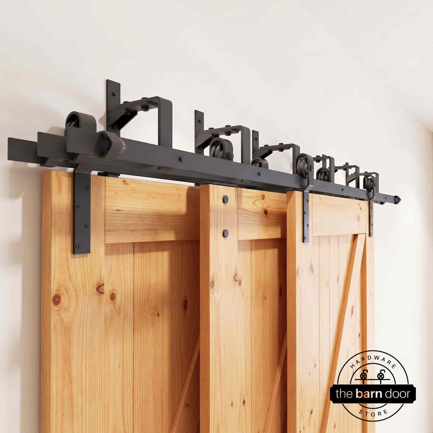 J-Strap Triple Track Bypass Barn Door Hardware Kit in matte black, showing three barn doors on a multi-track system.