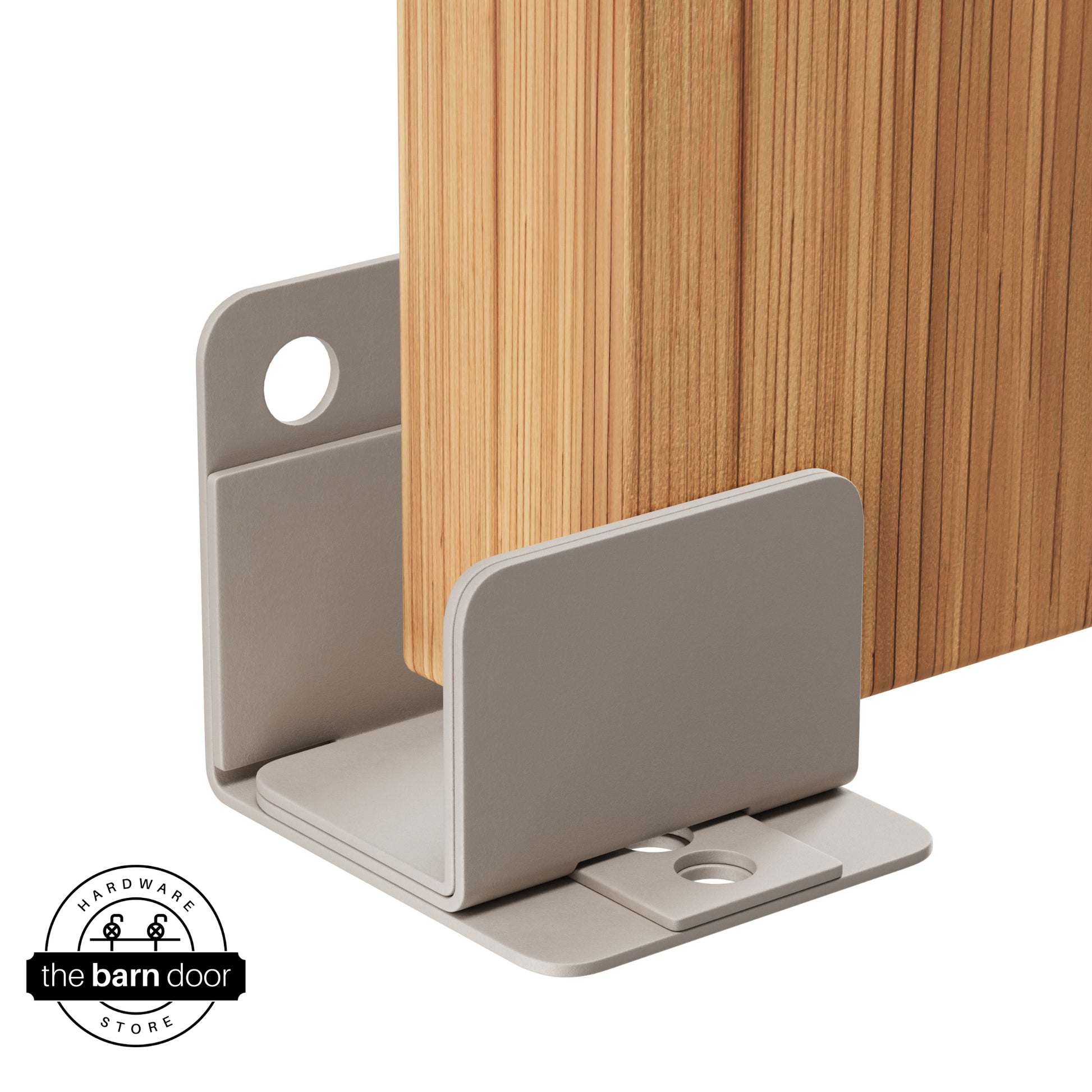 A white bronze U-shaped floor guide with a side plate, holding a light wood barn door in place.