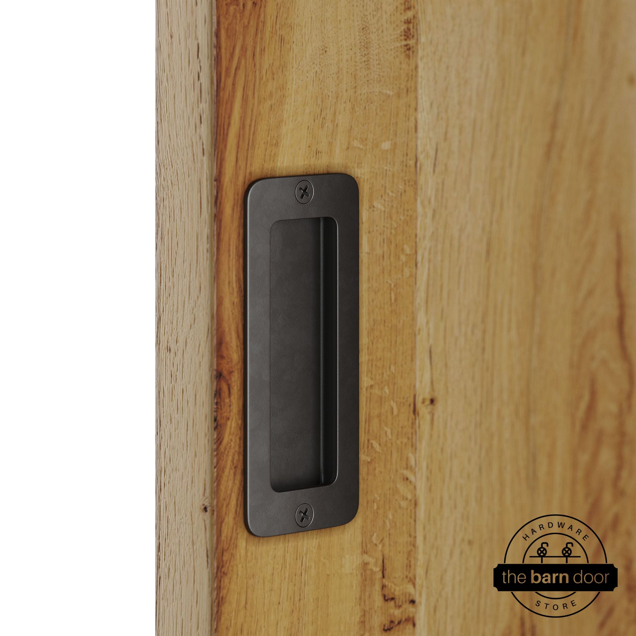 Arch bronze partial radius flush pull handle for sliding barn doors, installed on natural wood door panel