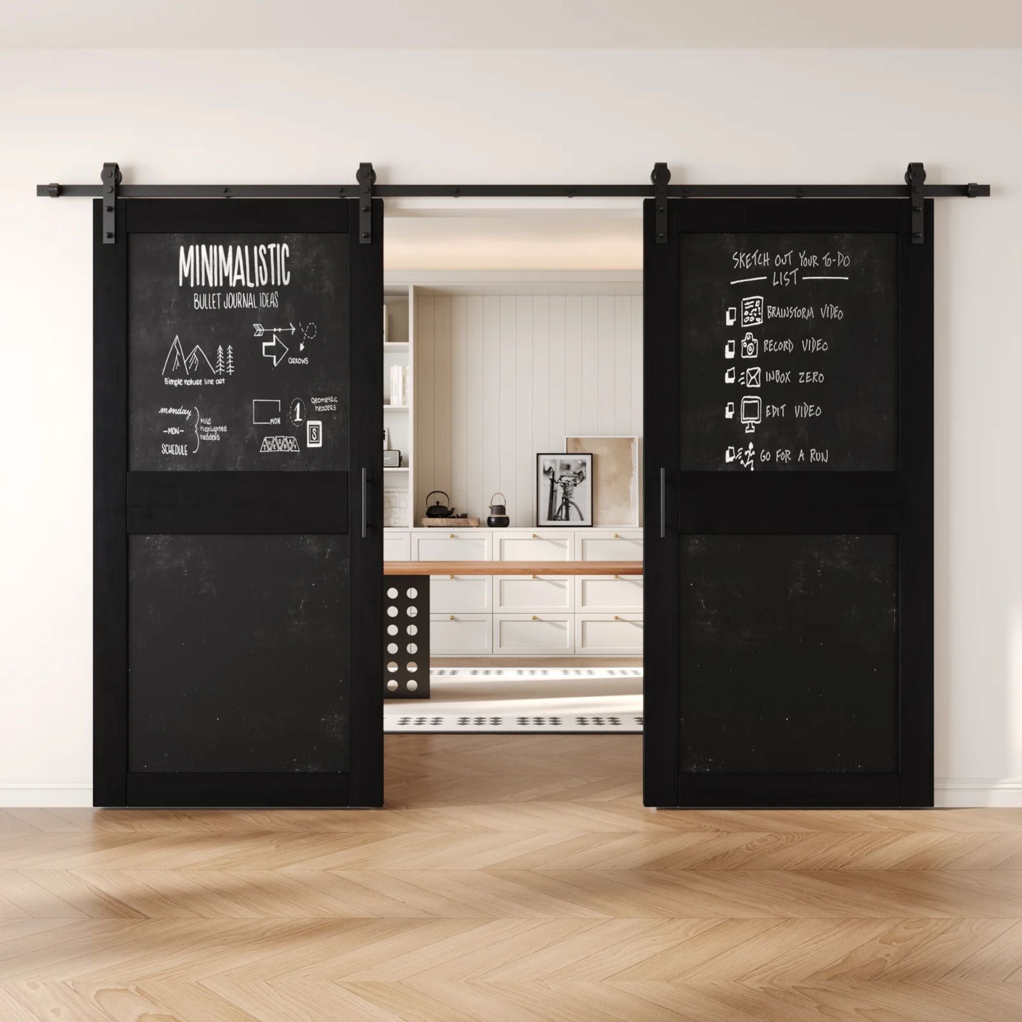 Black barn doors with black chalkboard surfaces in a modern interior setting