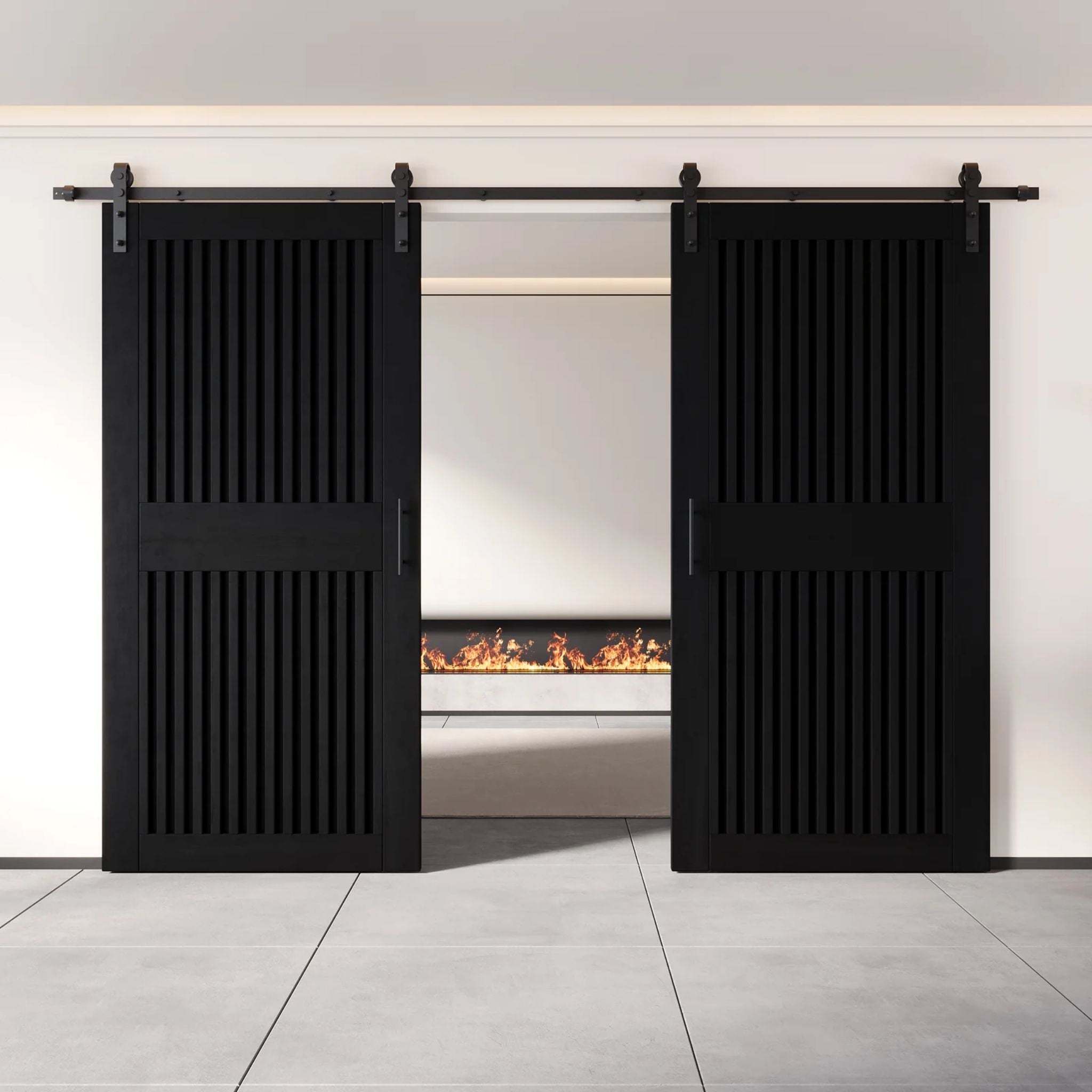 Black sliding barn doors with a modern fireplace in the background