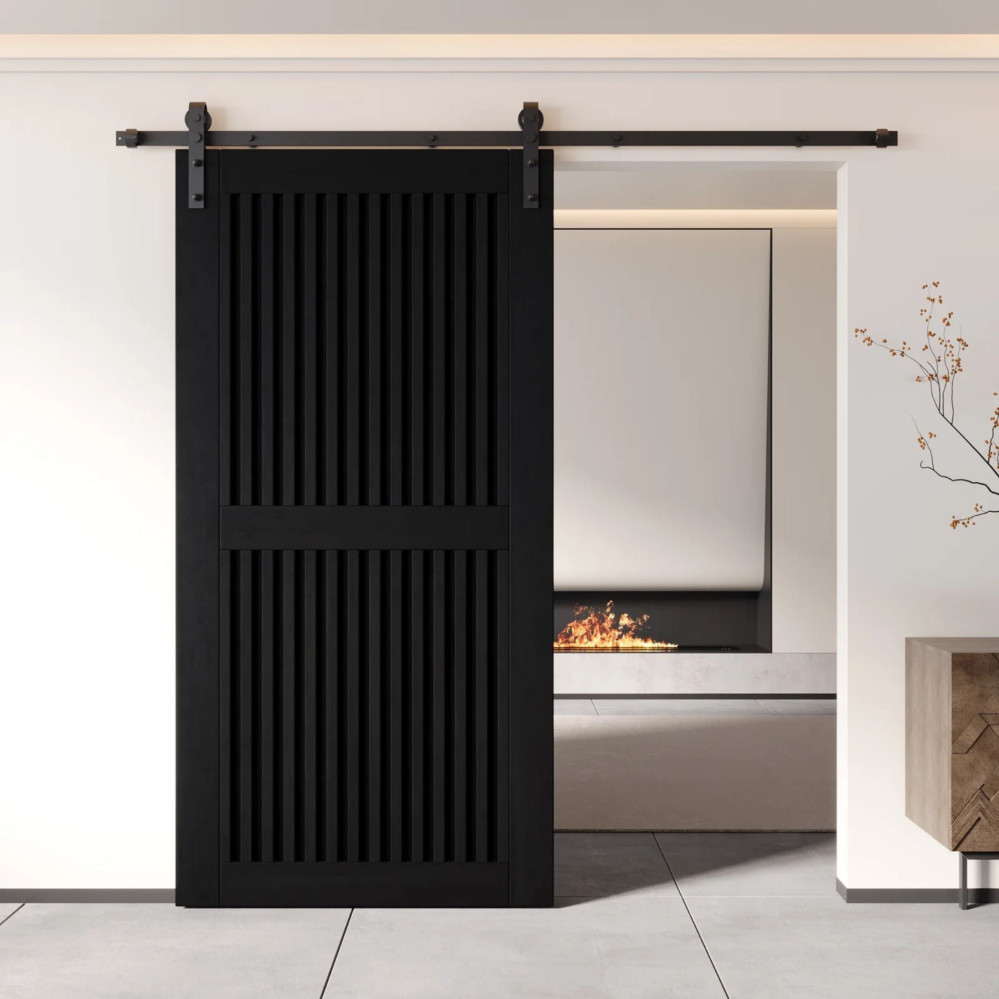 Black slatted sliding barn door in a modern interior setting with a fireplace.