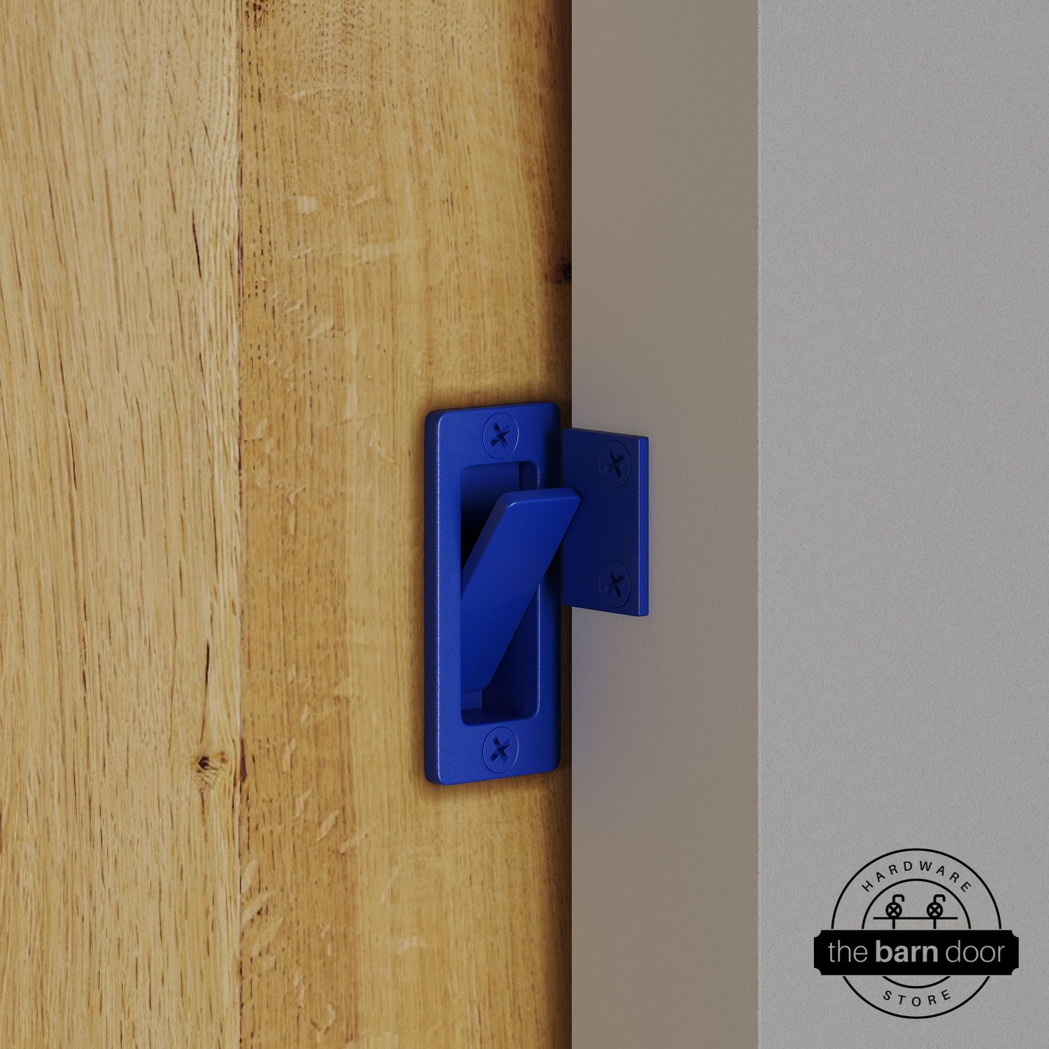 Blue privacy latch installed on a sliding barn door, shown in the locked position against door frame