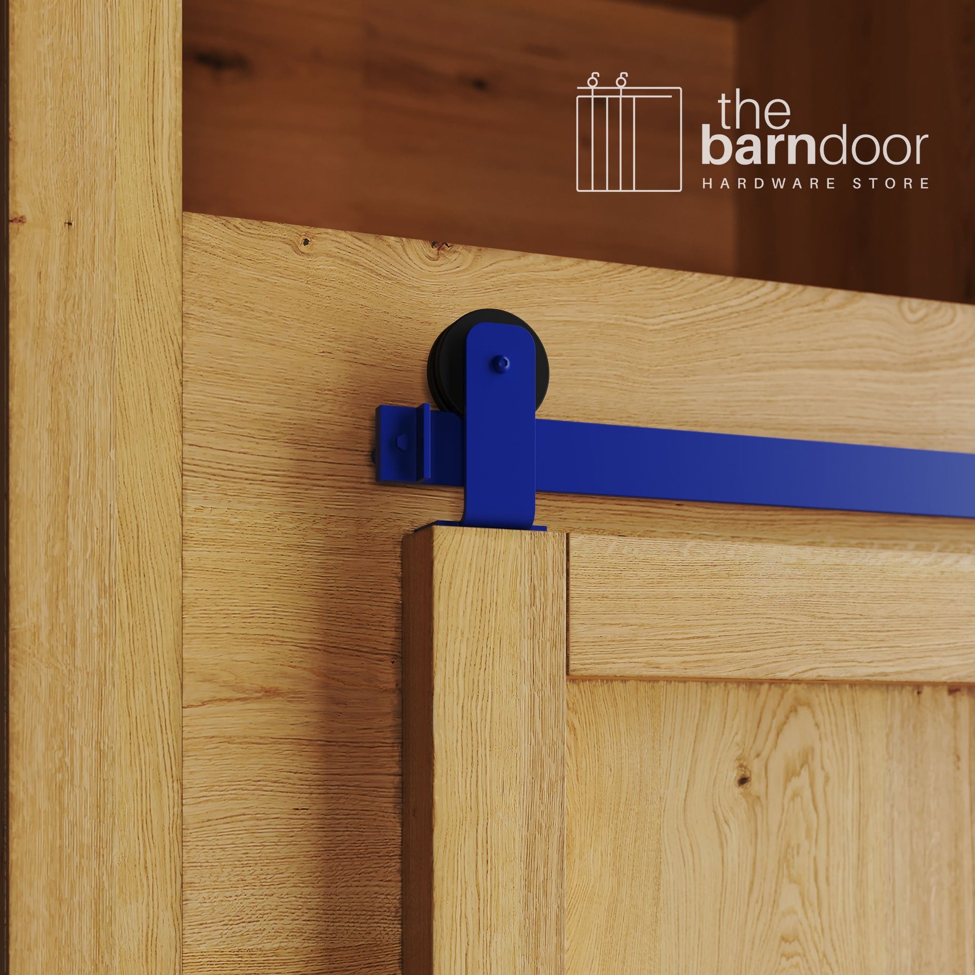 A close-up photograph of a sliding mini barn door on a natural oak cabinet, featuring blue top-mount straight hardware.