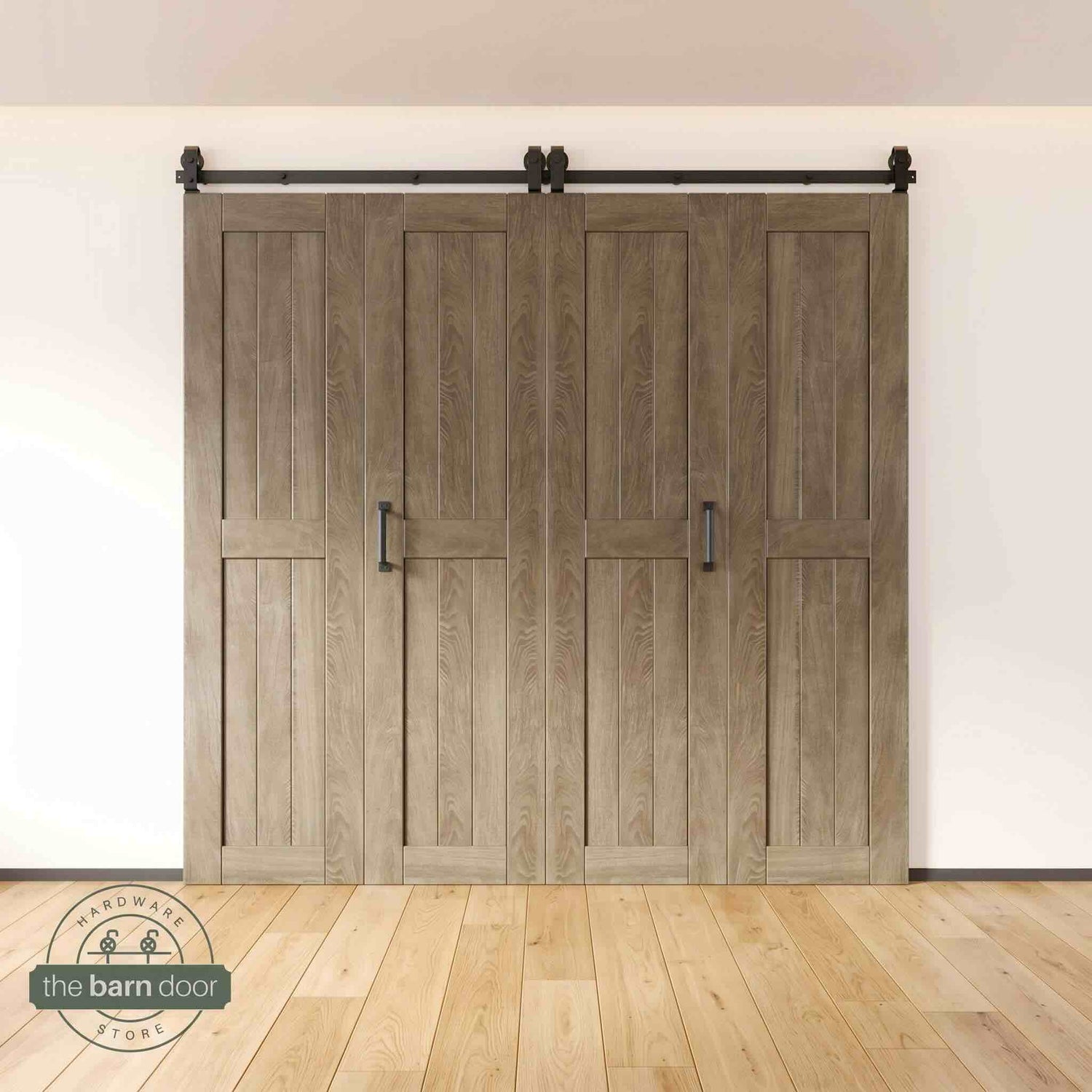 Four-panel bi-parting bifold barn door in a classic gray finish, fully closed in a modern entryway, showing the top-mount Matte Black track.
