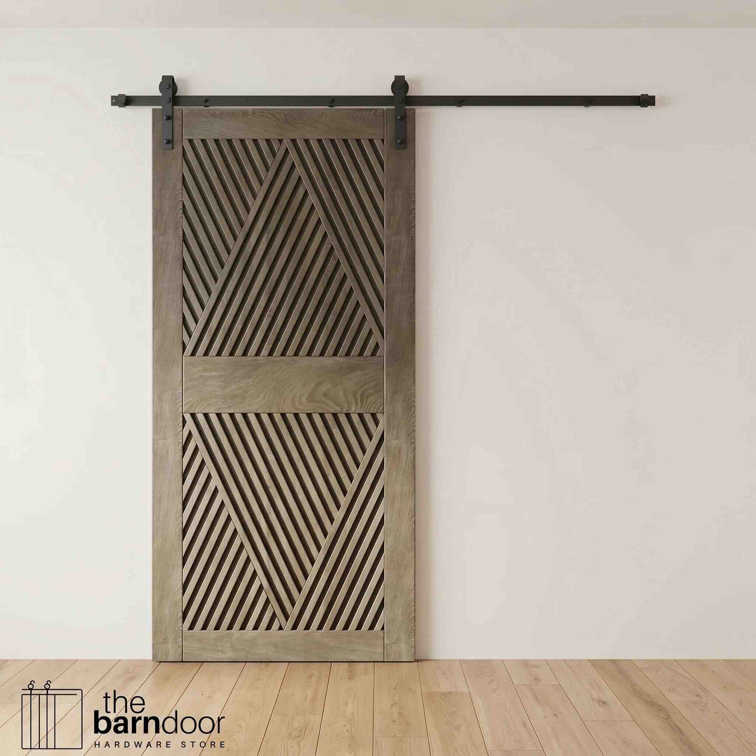 A modern classic gray barn door with an intricate geometric diamond pattern installed on a black track in a contemporary living space with a fireplace.