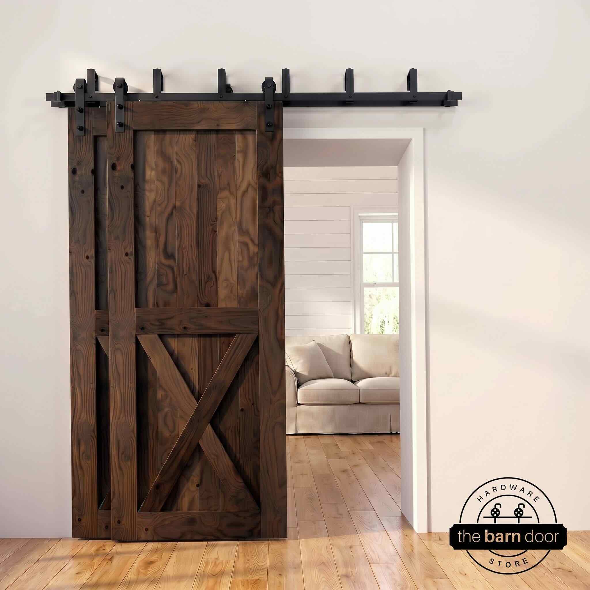Dark walnut pine bypass barn door with  black hardware track, mounted over living room entryway