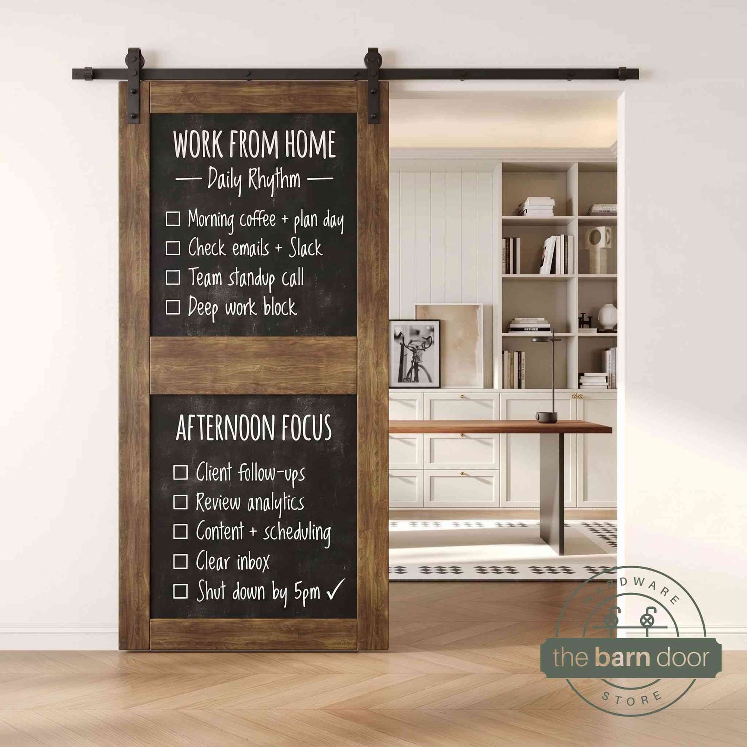 A dark walnut two-panel chalkboard barn door mounted on a sleek black sliding track, shown partially open to reveal a modern home office with built-in white shelving.