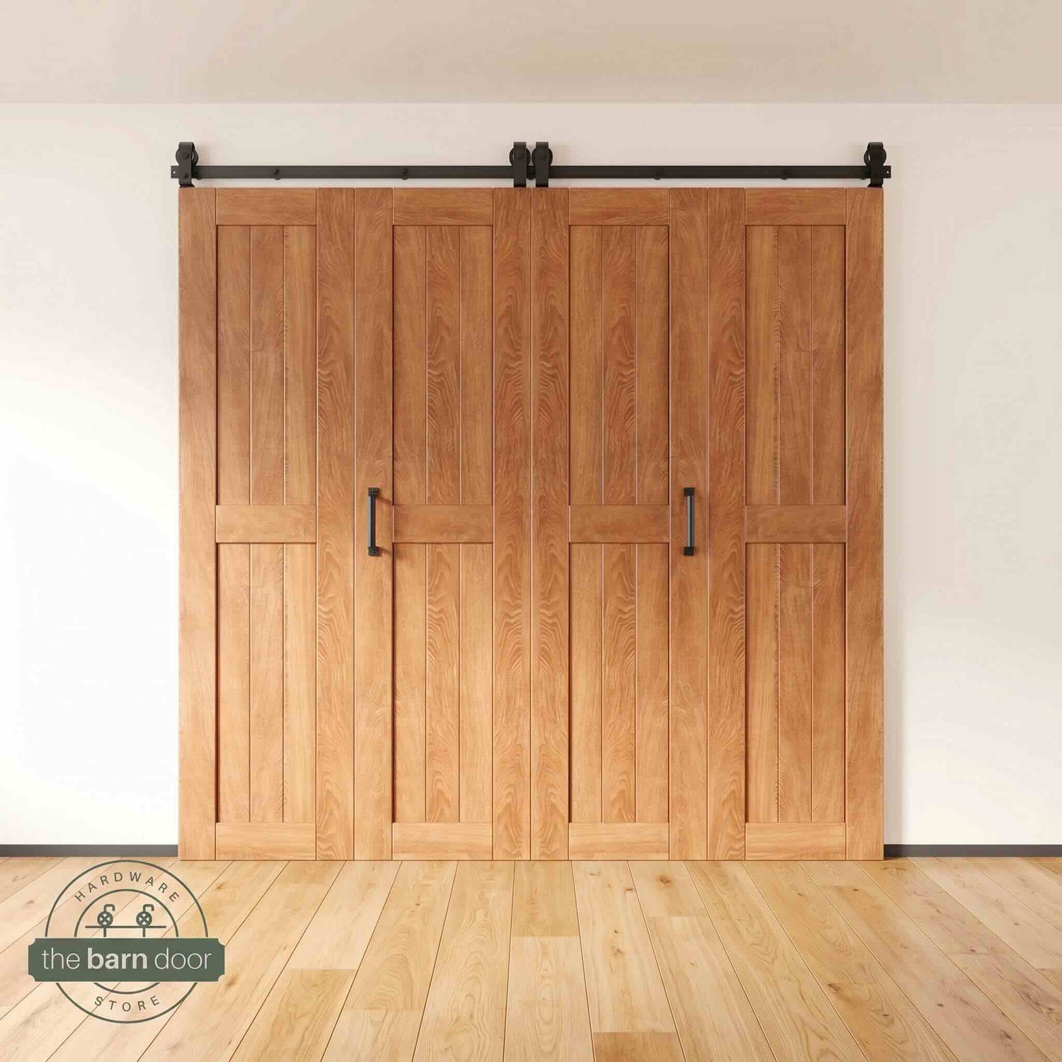 Four-panel bi-parting bifold barn door in an early American finish, fully closed in a modern entryway, showing the top-mount Matte Black track.