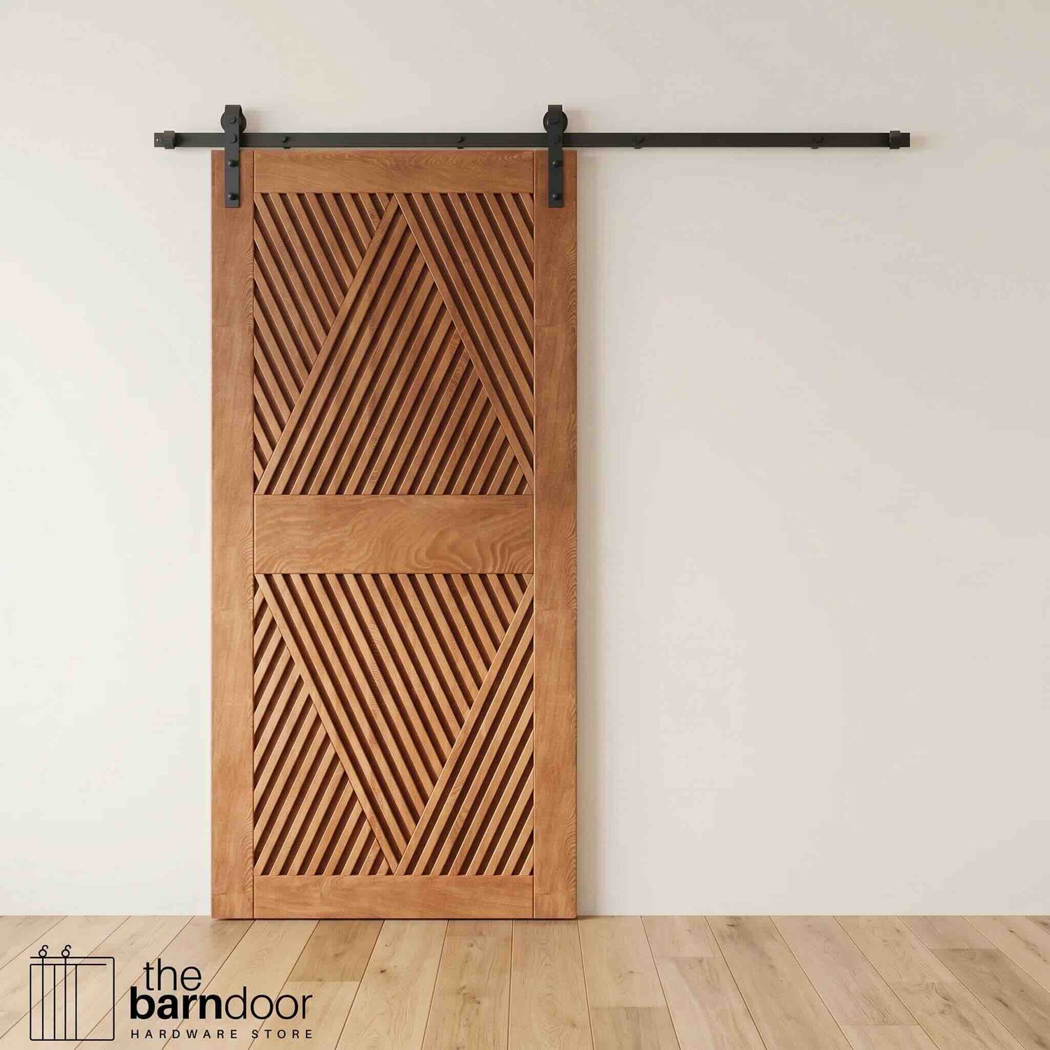 A modern Early American barn door with an intricate geometric diamond pattern installed on a black track in a contemporary living space with a fireplace.
