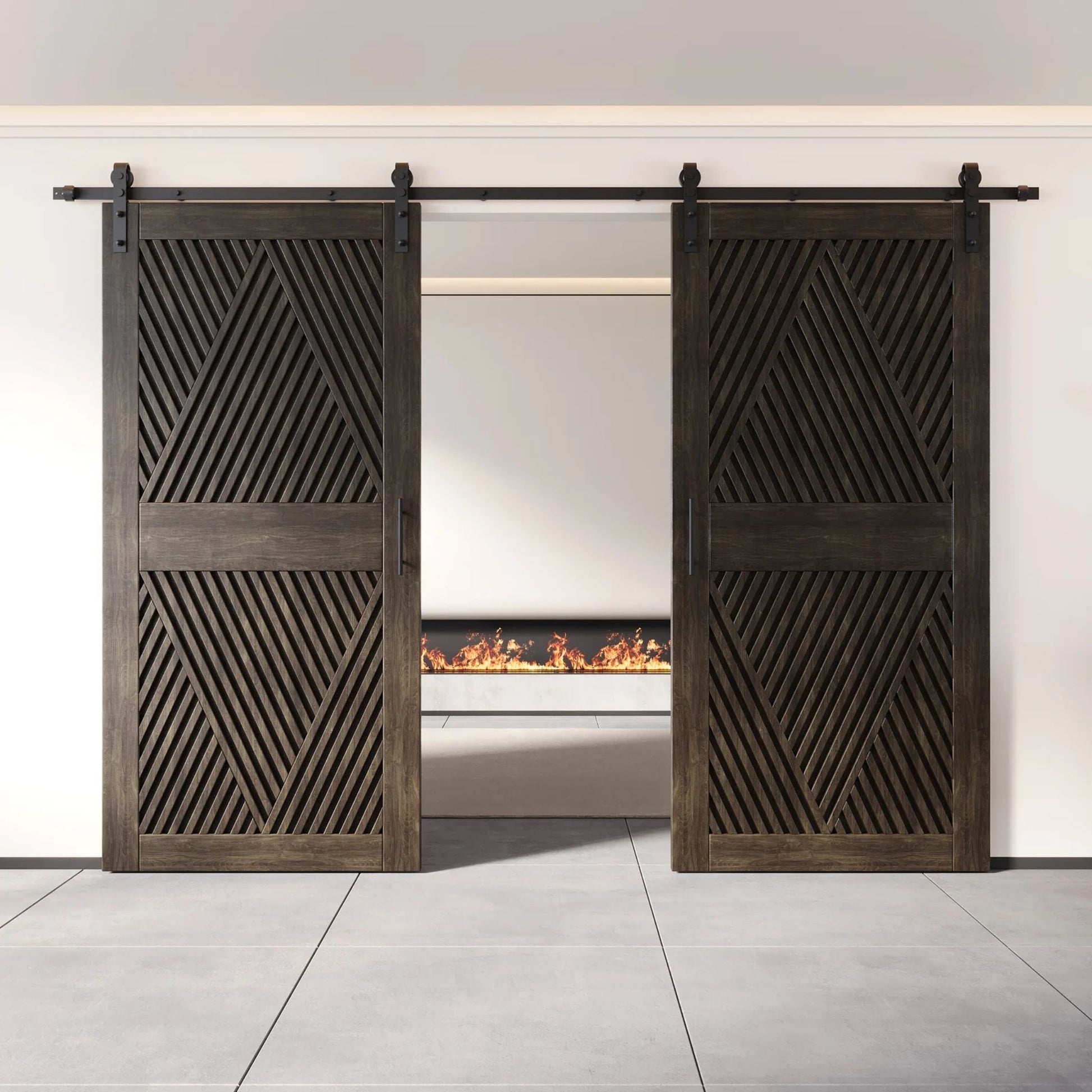 Two fully closed double barn doors in a ebony finish, featuring a bold, intricate diamond slat pattern. The doors are installed with black sliding hardware against a white wall, revealing a modern linear fireplace in the space behind them.
