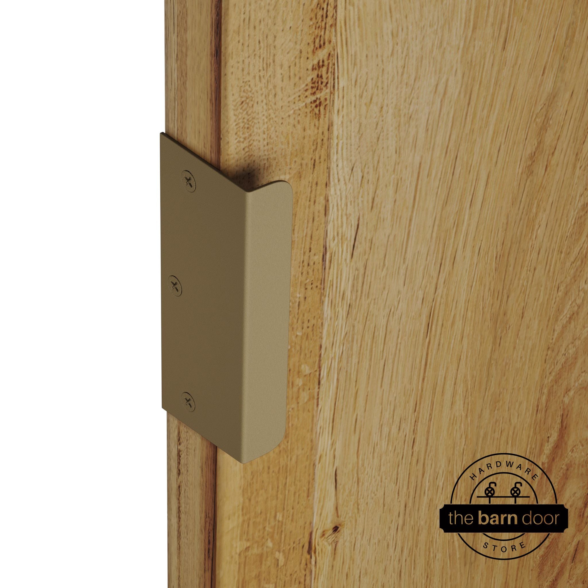 Gold sliding barn door edge pull handle on natural wood door edge
