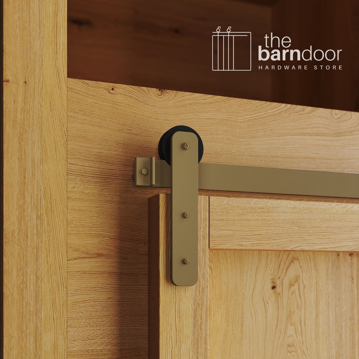 A close-up photograph of a natural oak cabinet with a sliding mini barn door, featuring a gold straight-strap hanger and a gold track system.
