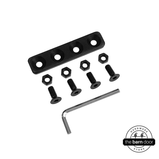 Overhead flat lay of a black junction plate kit, including the plate, four bolts, four nuts, and an Allen wrench.