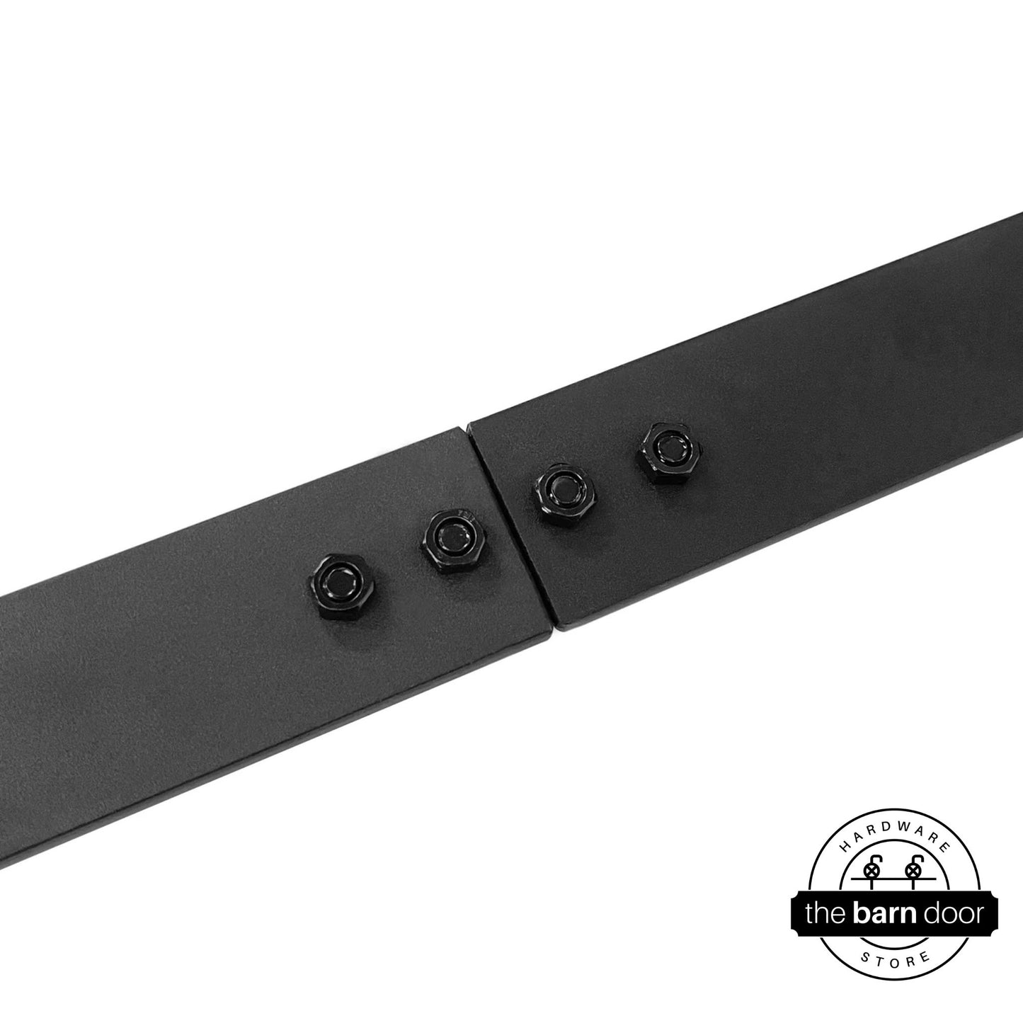 Close-up of two matte black barn door track sections joined with a junction plate and four exposed bolts.