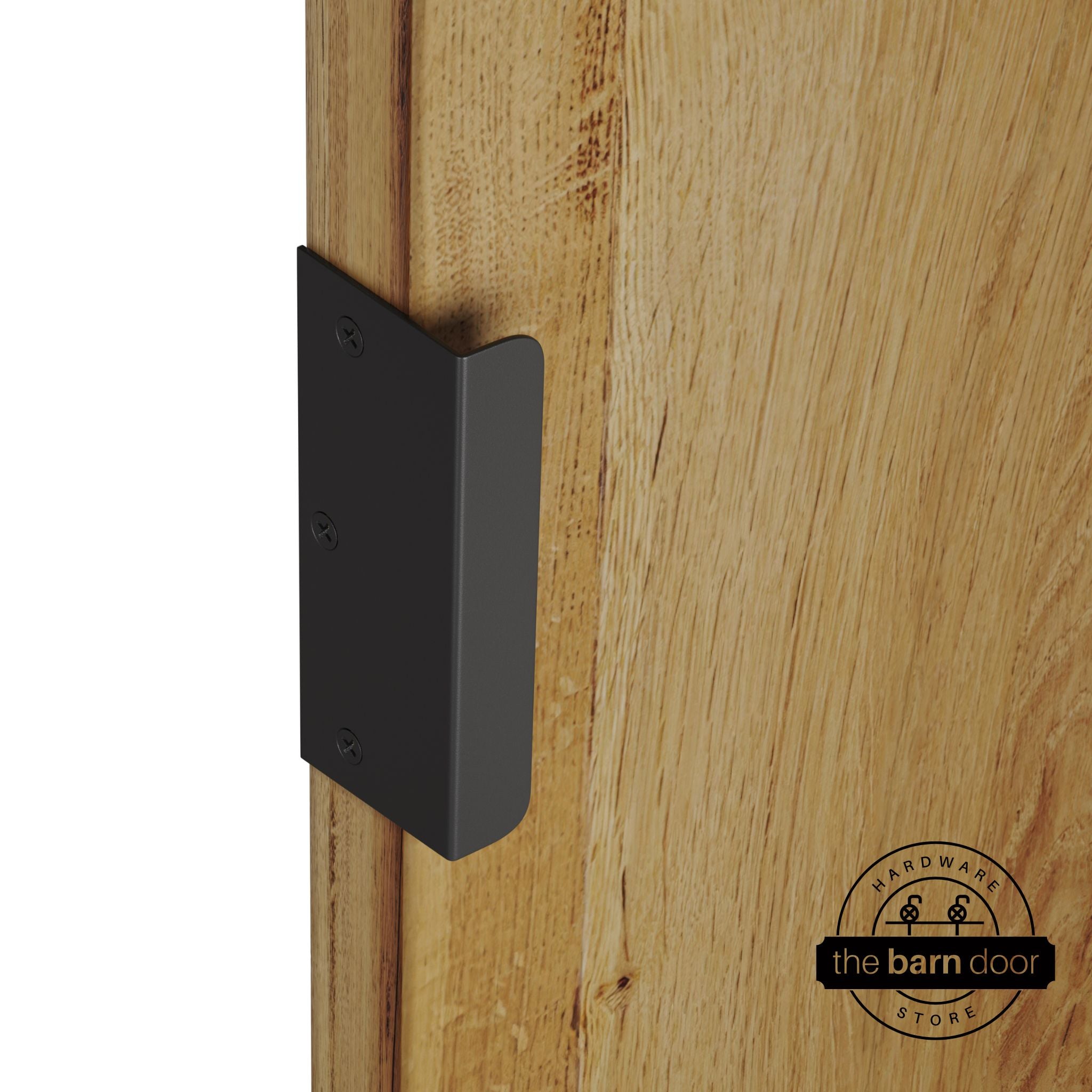 Matte black sliding barn door edge pull handle on natural wood door edge